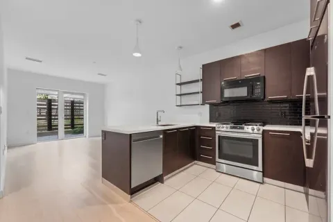 a kitchen with stainless steel appliances granite countertop a stove and a sink