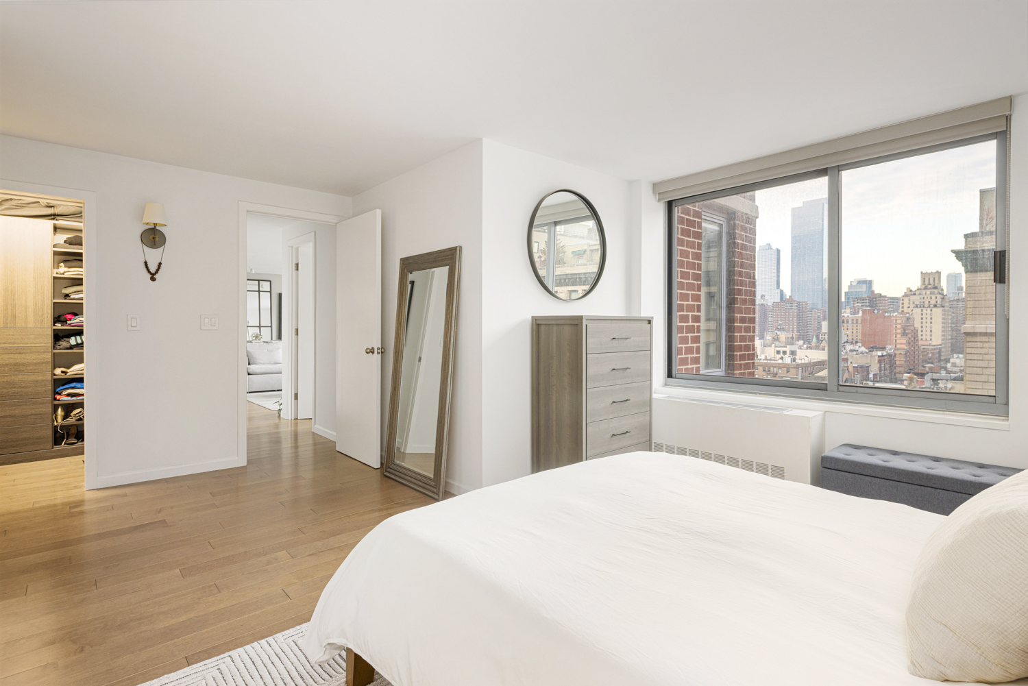 270 West 17th Street, Unit 11BC Manhattan, NY 10011 - Photo 12 of 13 a bedroom with a large bed and a large window