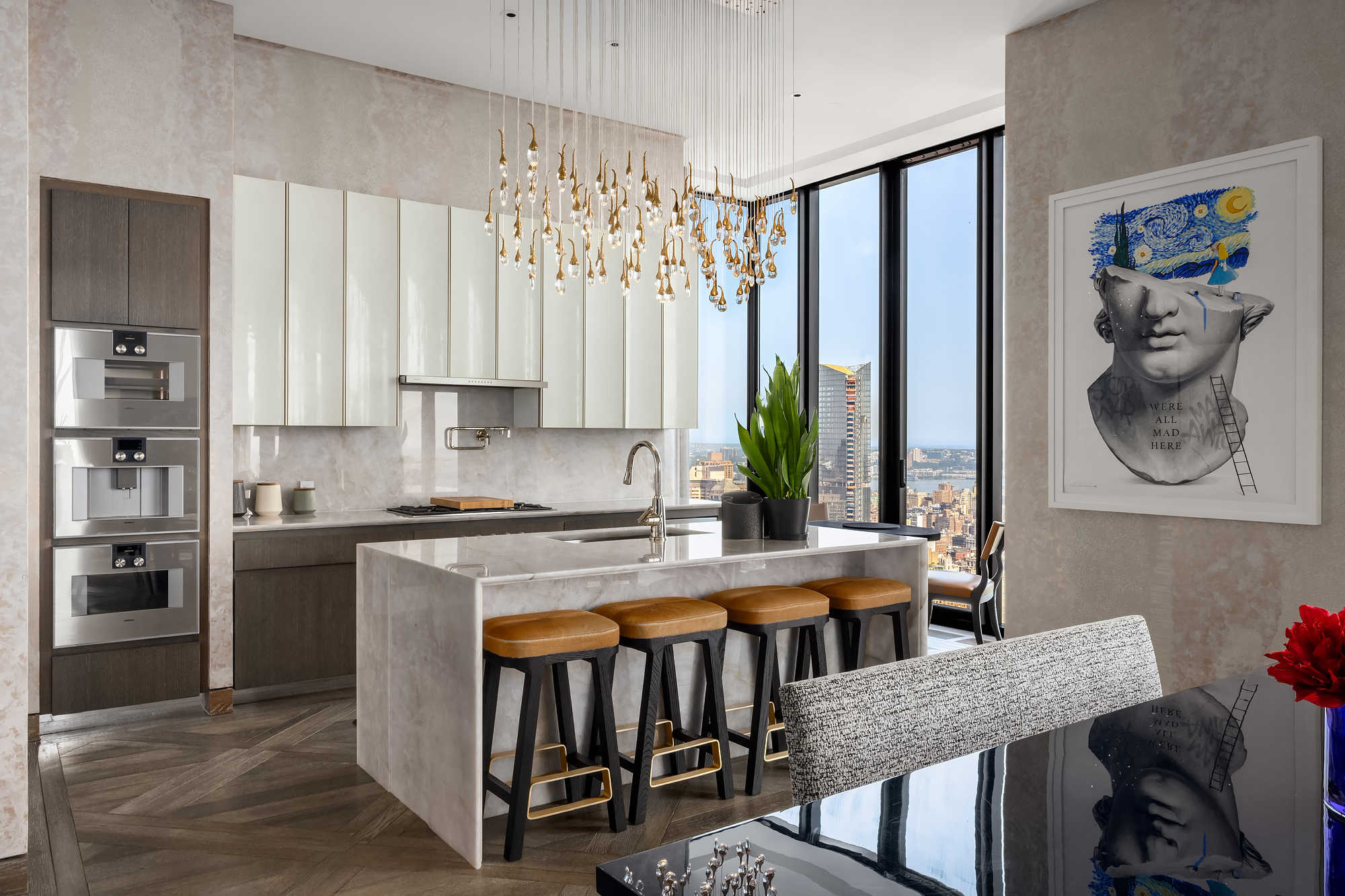 111 West 57th Street, Unit 46 Manhattan, NY 10019 - Photo 4 of 14 a kitchen with stainless steel appliances granite countertop a stove a refrigerator a sink and white cabinets