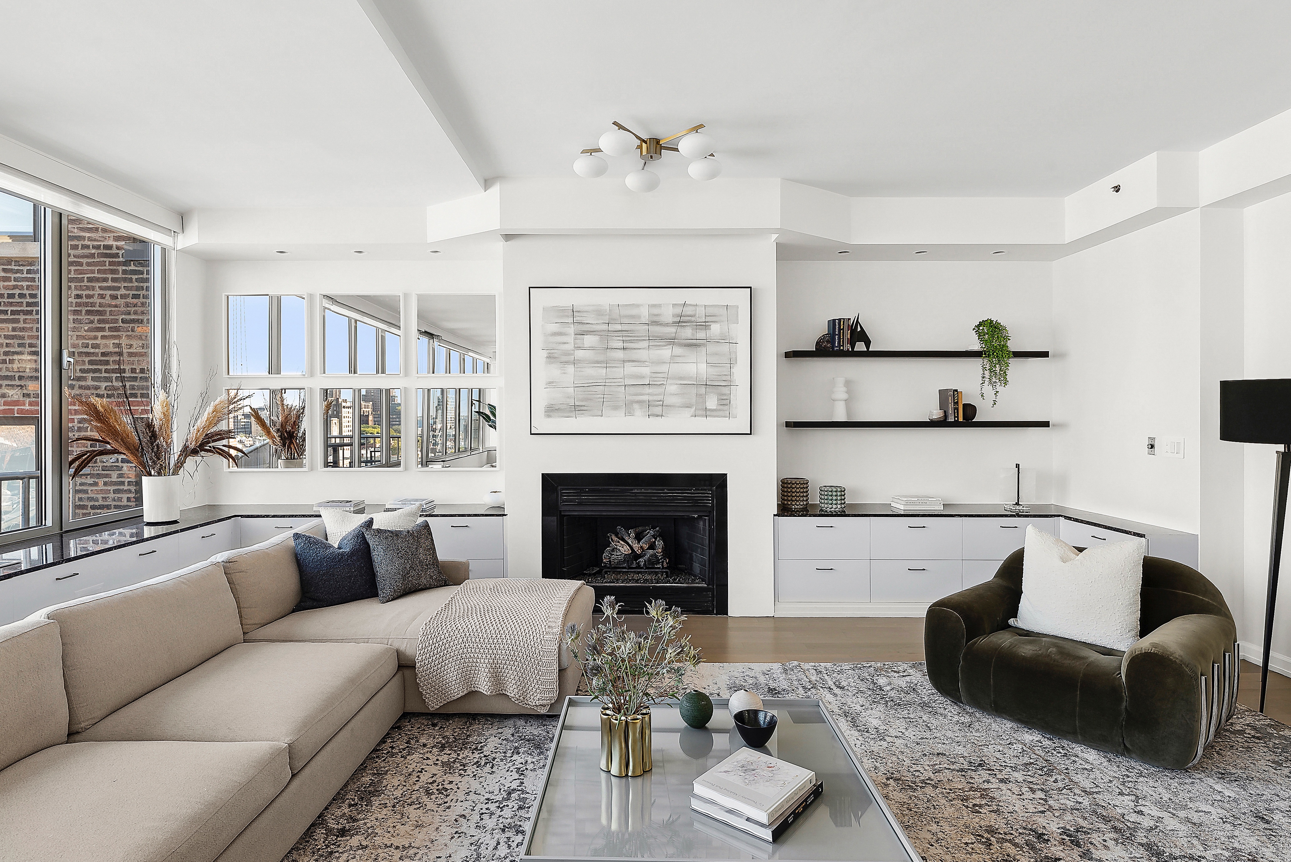 224 West 18th Street, Unit PHA Manhattan, NY 10011 - Photo 13 of 24 a living room with furniture and a fireplace