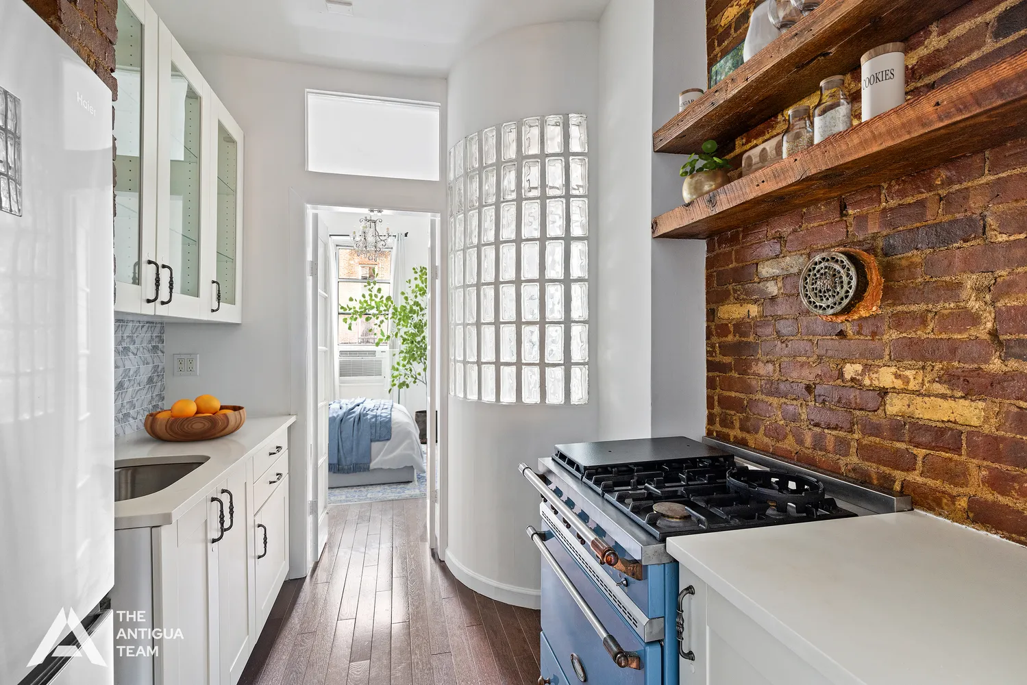 a kitchen with a cabinets a sink and a window