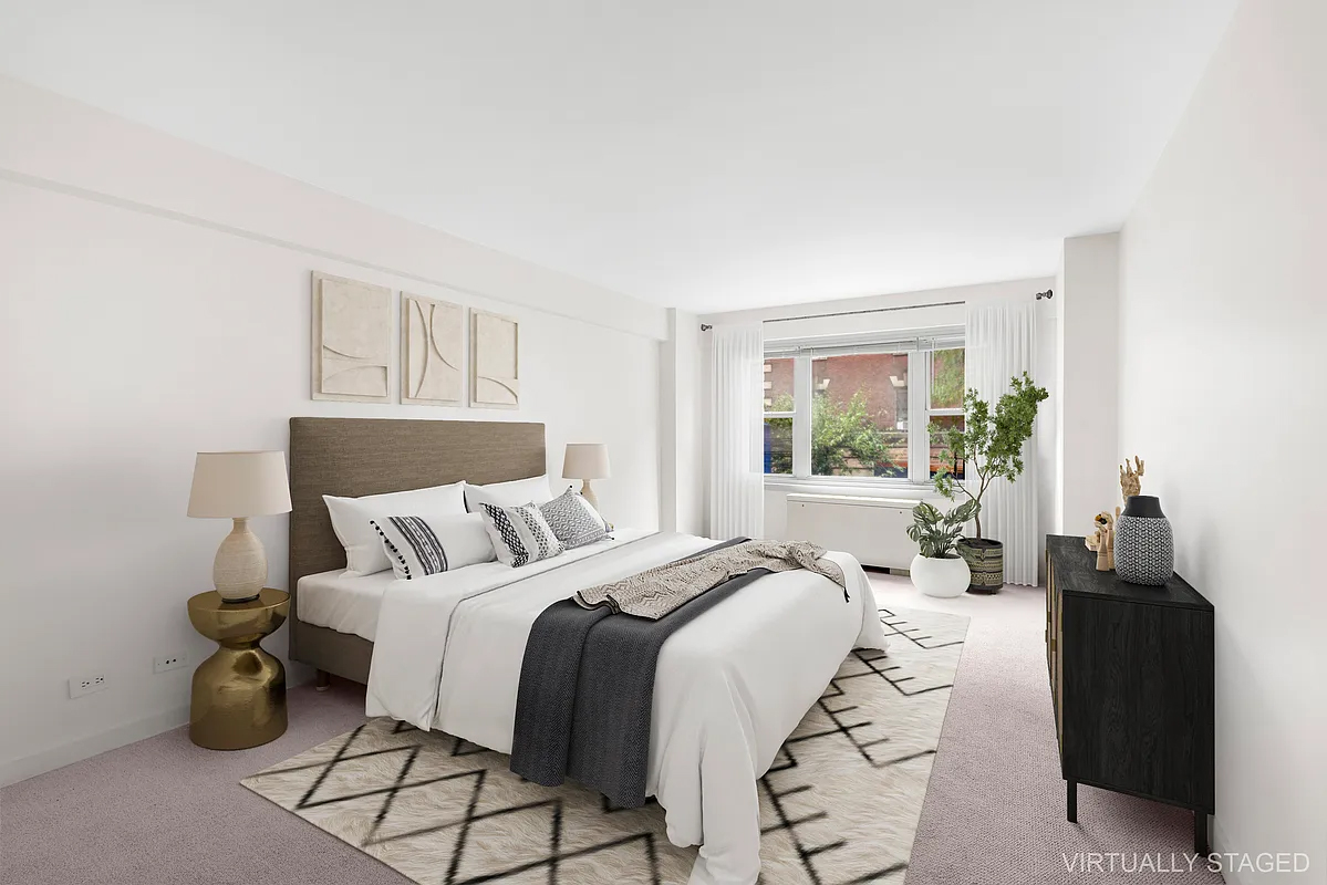 333 East 66th Street, Unit 2FE Manhattan, NY 10065 - Photo 6 of 19 a bedroom with a bed and wooden floor