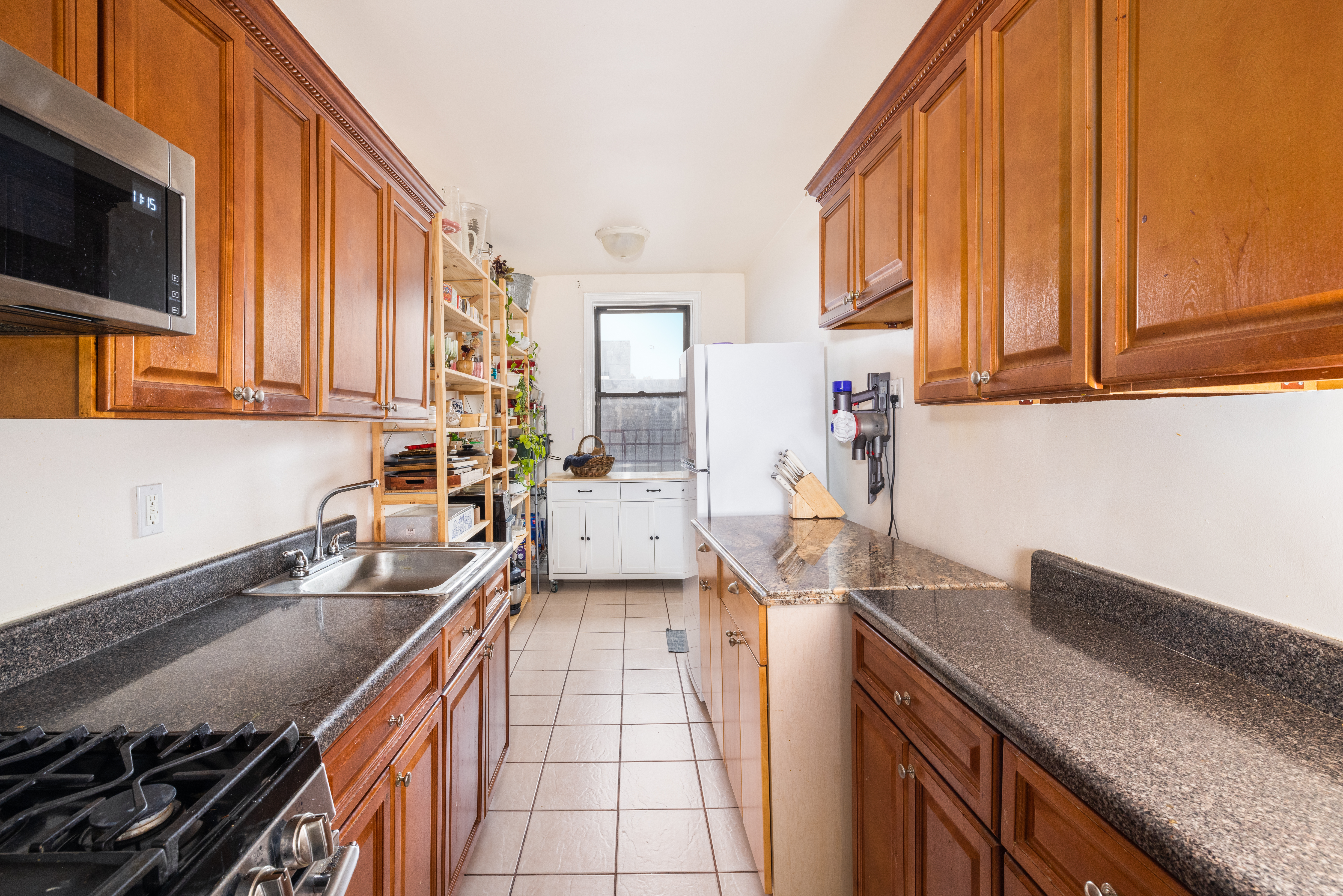 1680 Ocean Avenue, Unit 6D Brooklyn, NY 11230 - Photo 3 of 9 a kitchen with a sink and cabinets