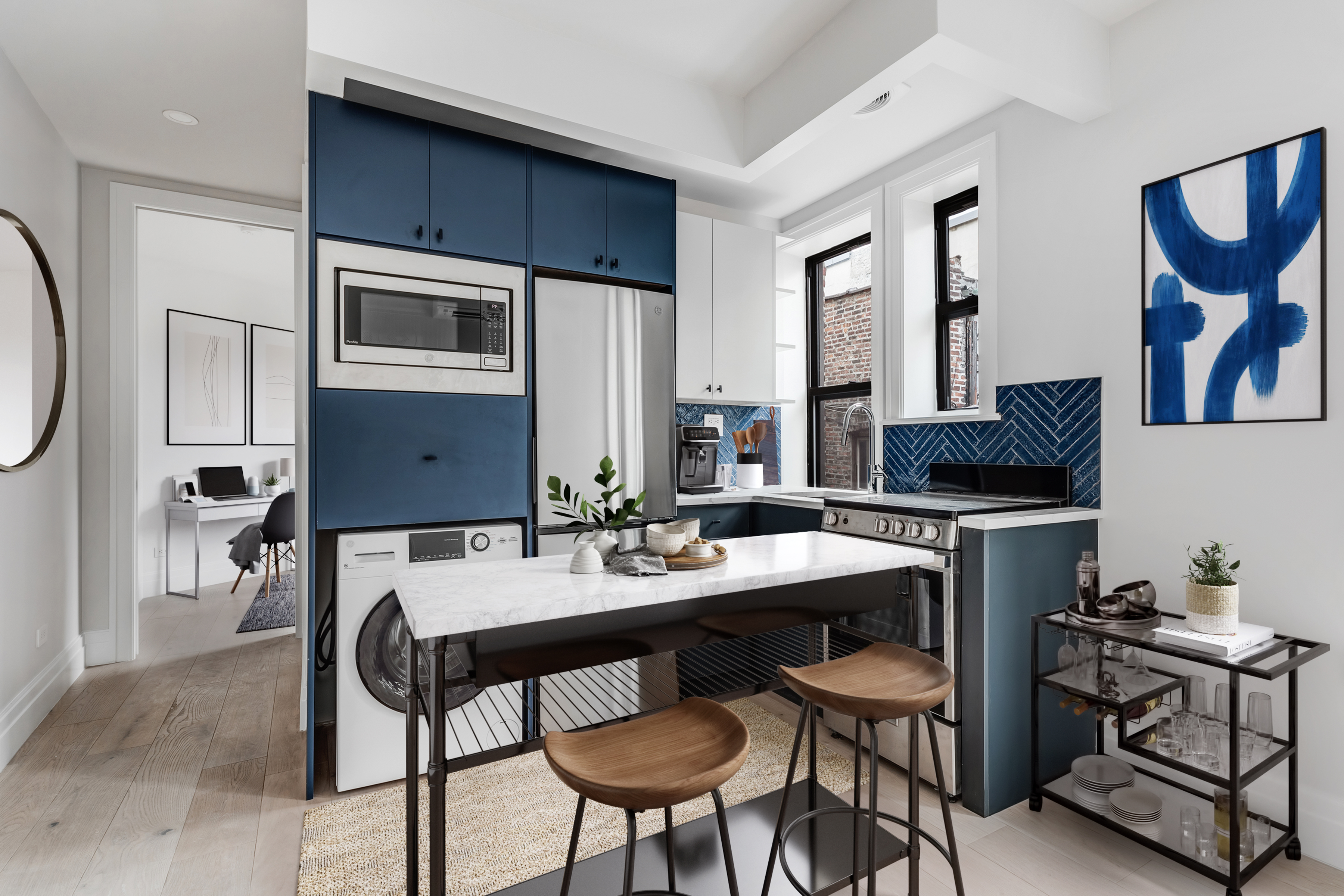 a kitchen with a dining table and chairs
