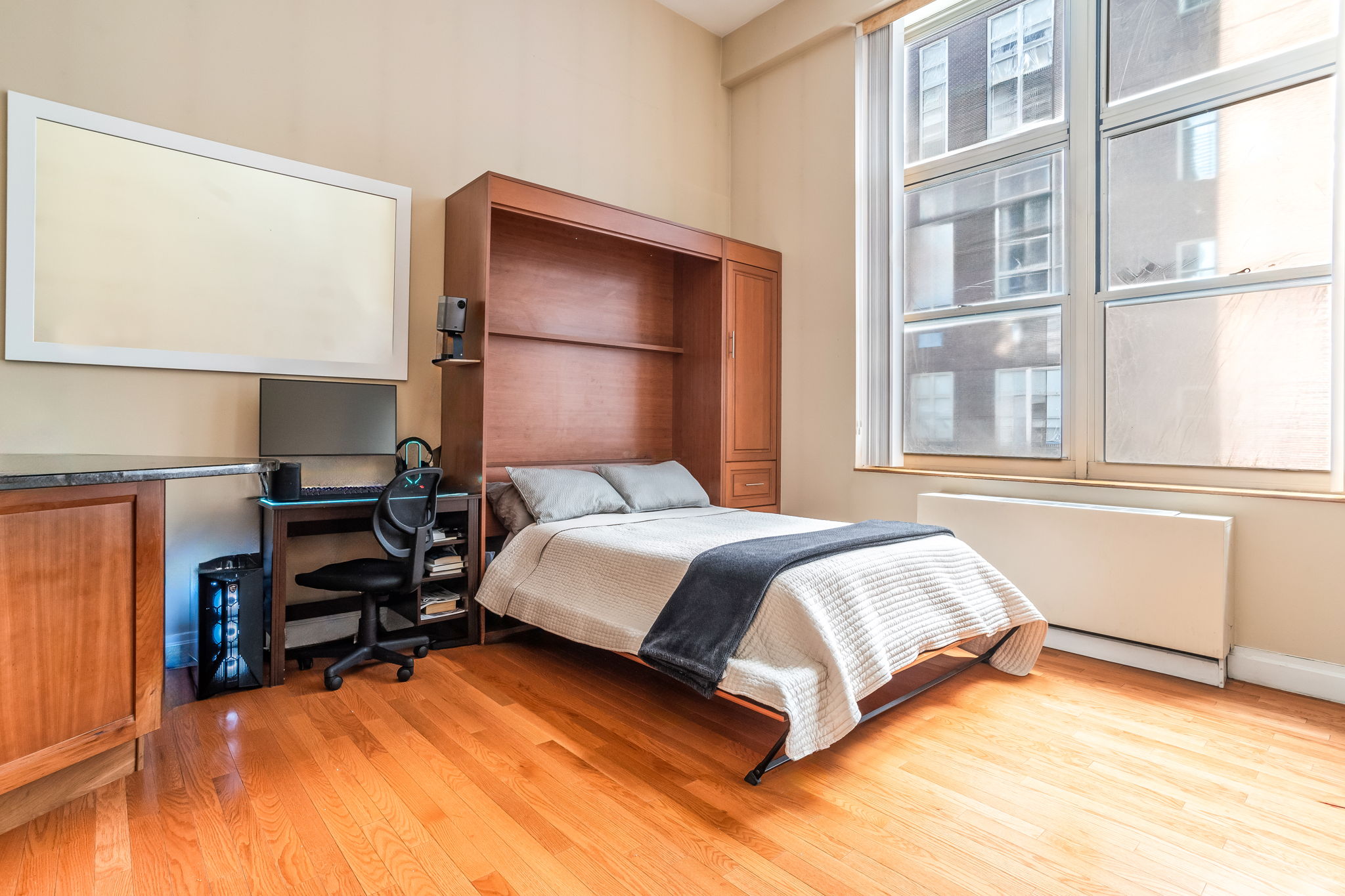 120 East 87th Street, Unit R6L Manhattan, NY 10028 - Photo 3 of 19 a bedroom with a bed and a large window