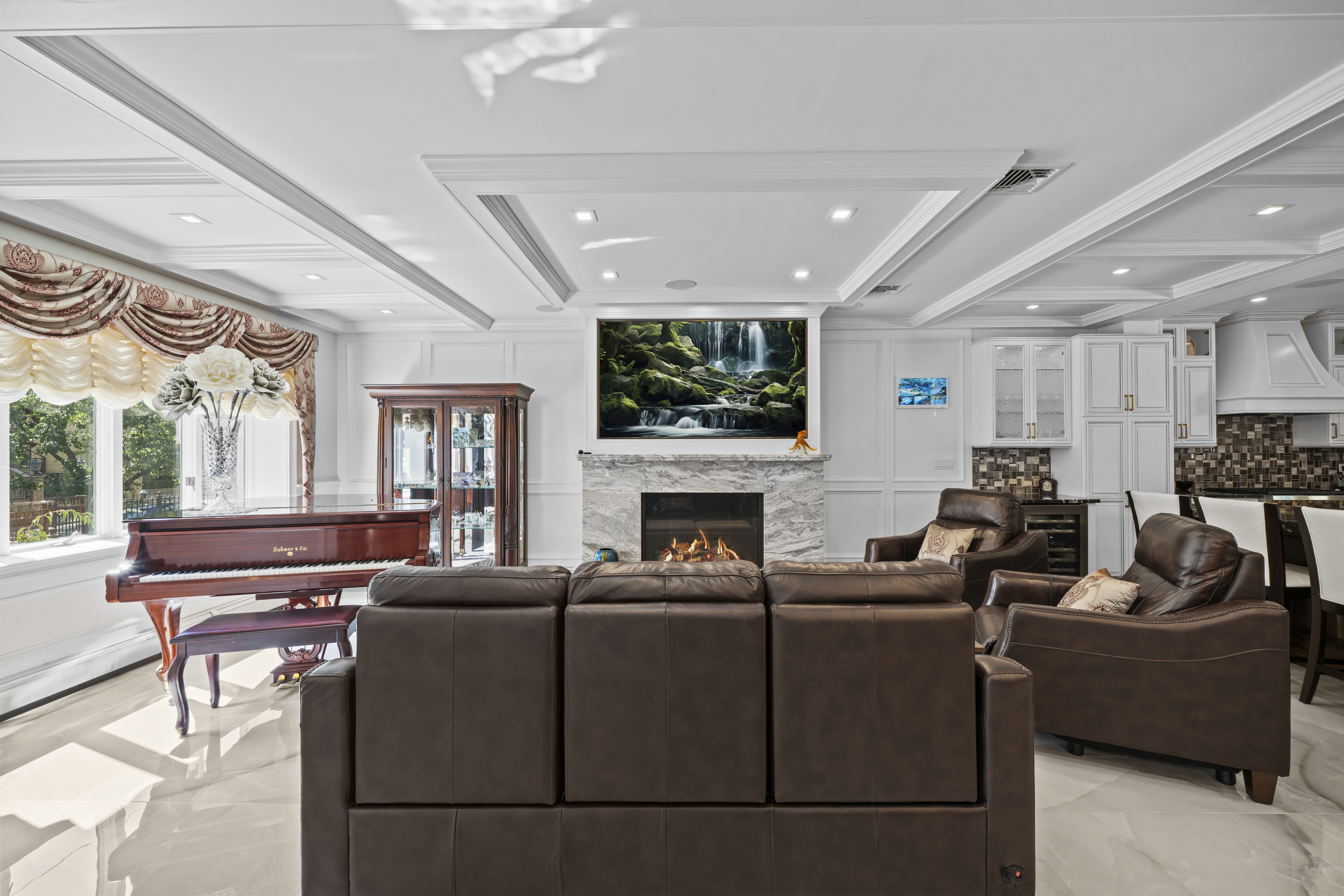 2253 East 64th Street Brooklyn, NY 11234 - Photo 12 of 45 a living room with furniture a fireplace and a flat screen tv