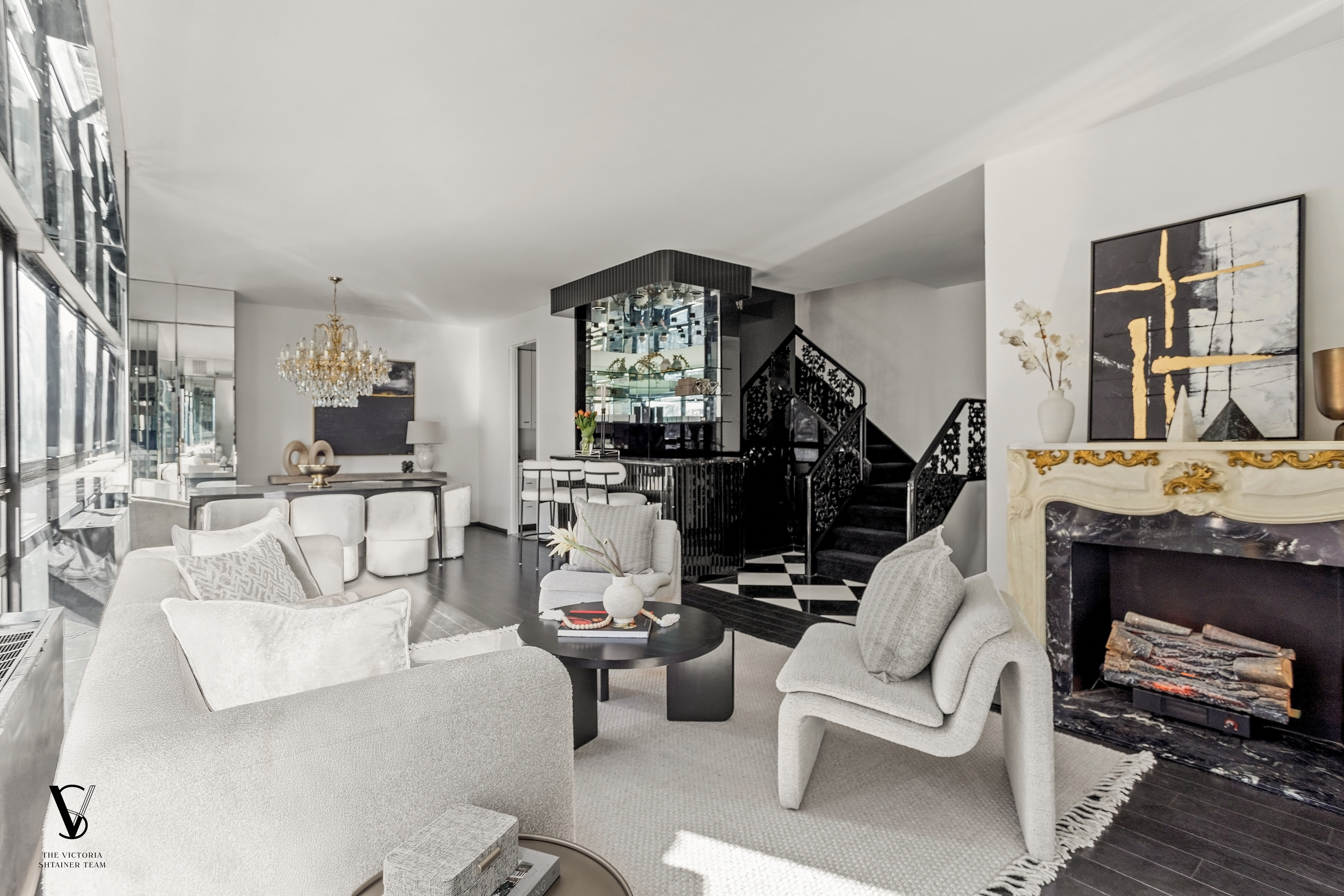 415 East 54th Street, Unit 6D Manhattan, NY 10022 - Photo 3 of 18 a living room with furniture a rug and a fireplace