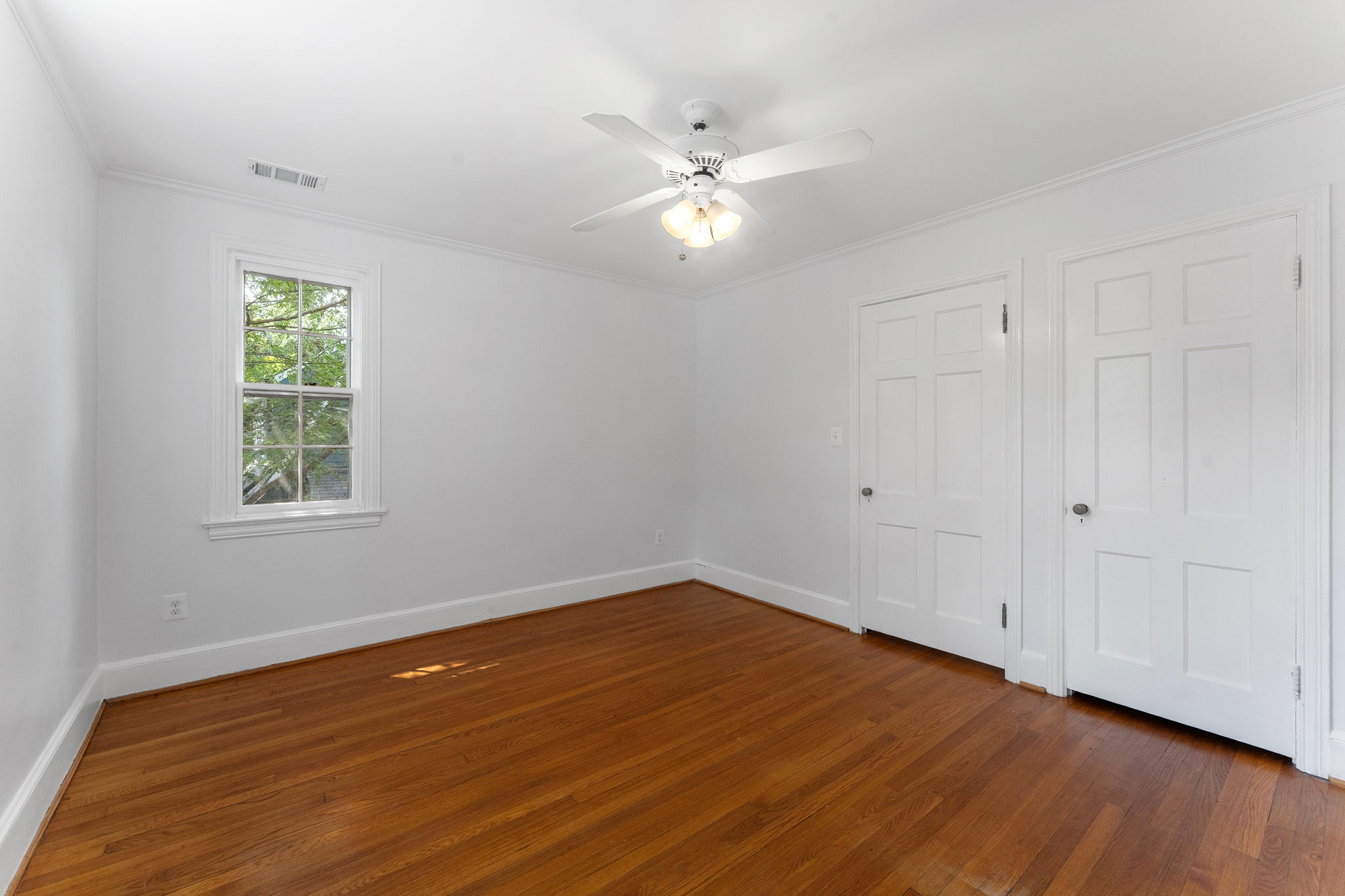1325 Locust Road Northwest Washington, DC 20012 - Photo 36 of 56 a view of an empty room with wooden floor and a window