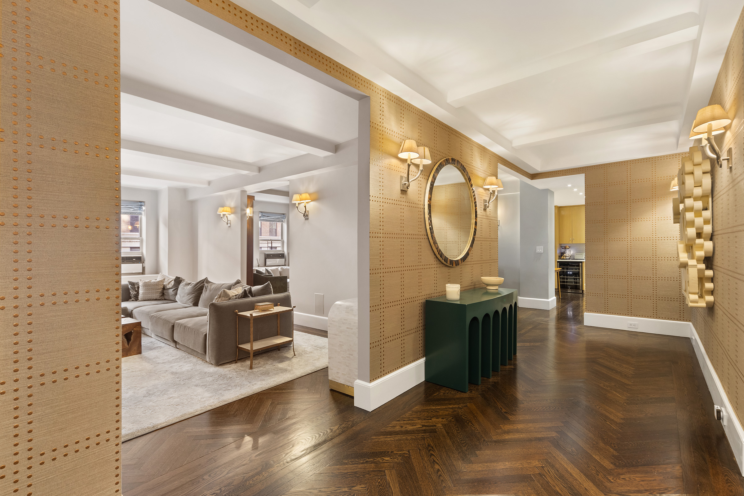 25 East 86th Street, Unit 3C Manhattan, NY 10028 - Photo 1 of 15 a living room with furniture a mirror and a table