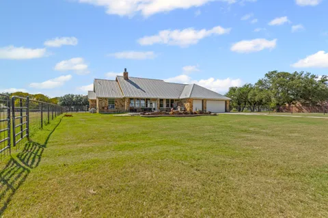 a view of a swimming pool and a yard
