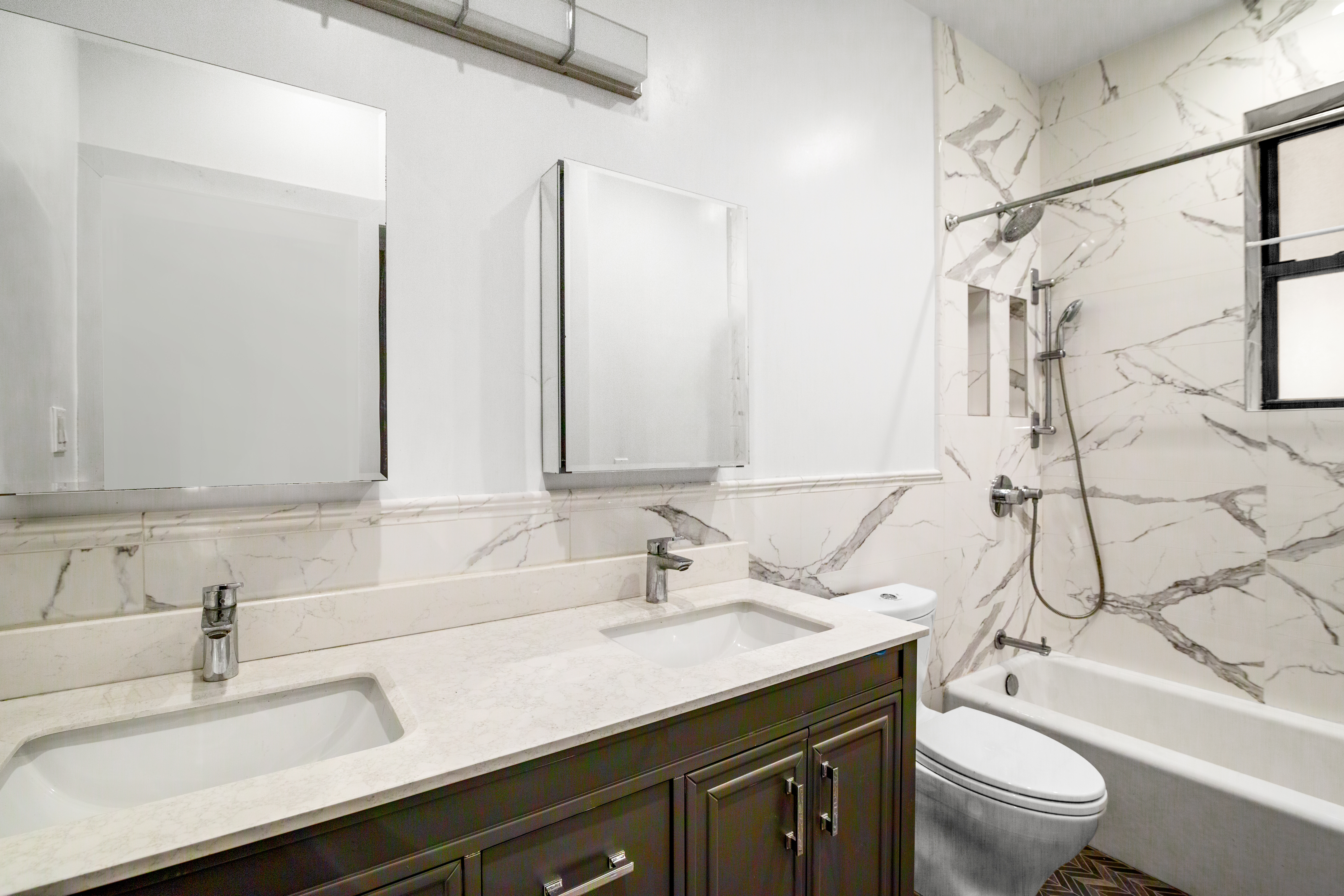 170 East 94th Street, Unit 1C Manhattan, NY 10128 - Photo 5 of 9 a bathroom with a granite countertop sink a toilet and a mirror