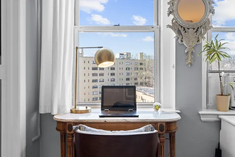 a bathroom with a sink a mirror and shower curtain