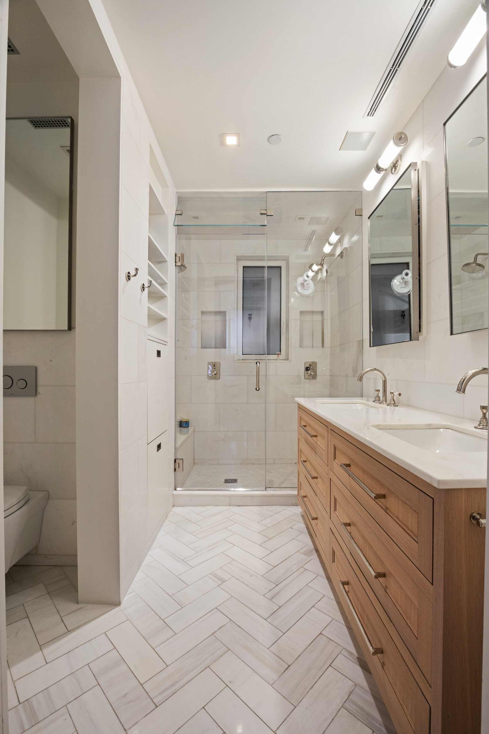 5 Harrison Street, Unit 3 Manhattan, NY 10013 - Photo 9 of 14 a spacious bathroom with a granite countertop sink mirror and toilet