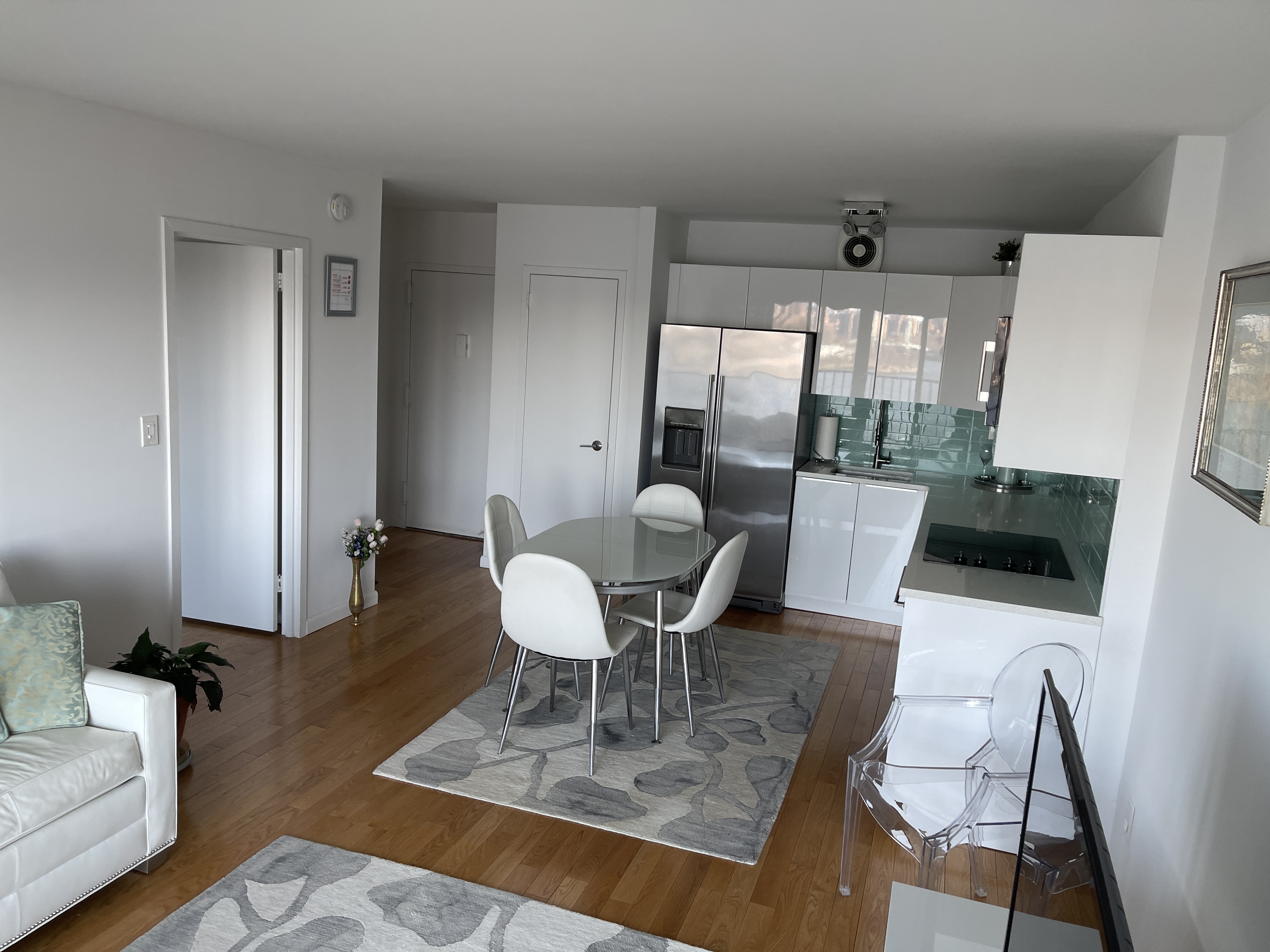 25-40 Shore Boulevard, Unit 15T Queens, NY 11102 - Photo 3 of 22 a view of a dining room with furniture