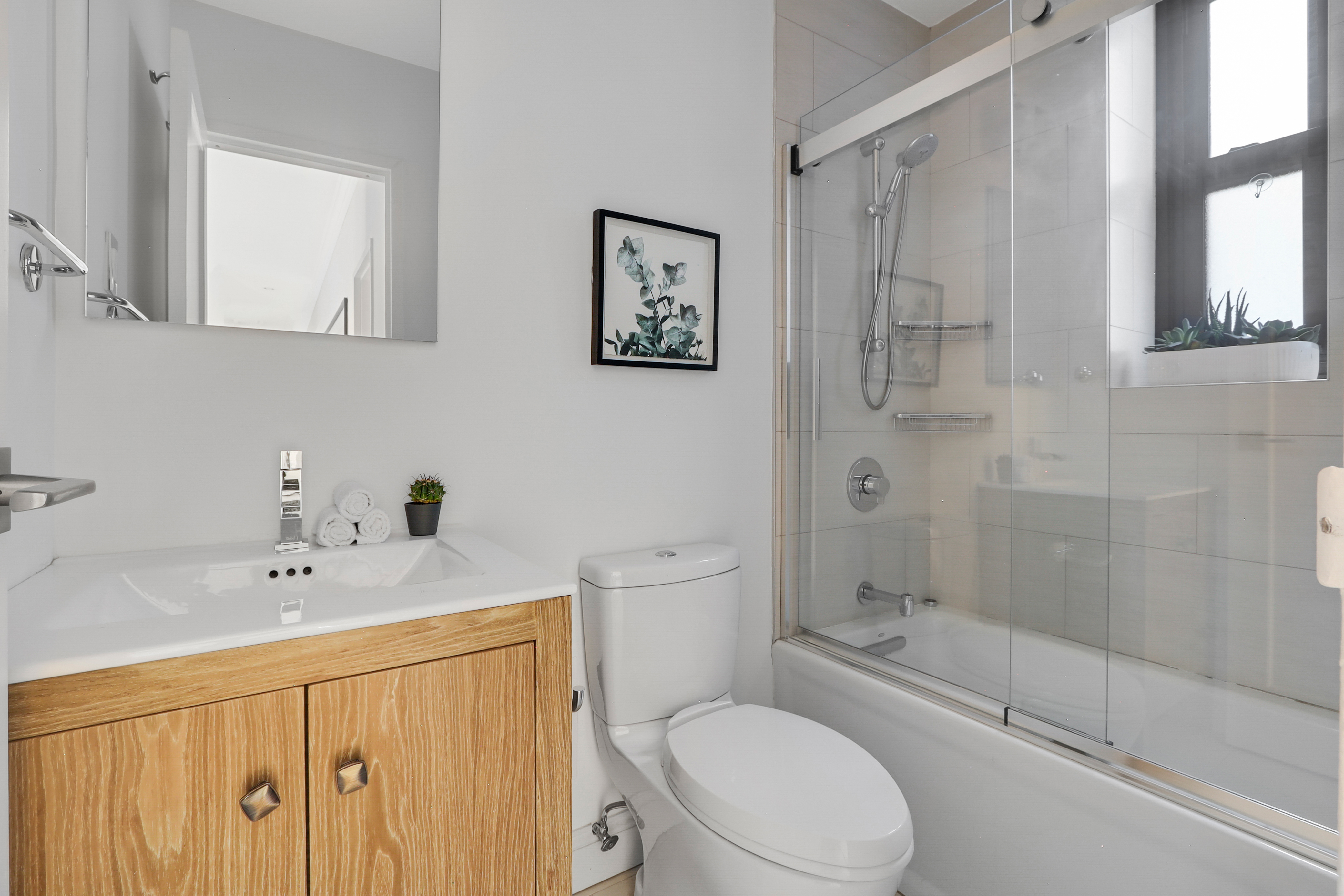 250 West 103rd Street, Unit 4A Manhattan, NY 10025 - Photo 11 of 14 a bathroom with a sink a toilet and shower