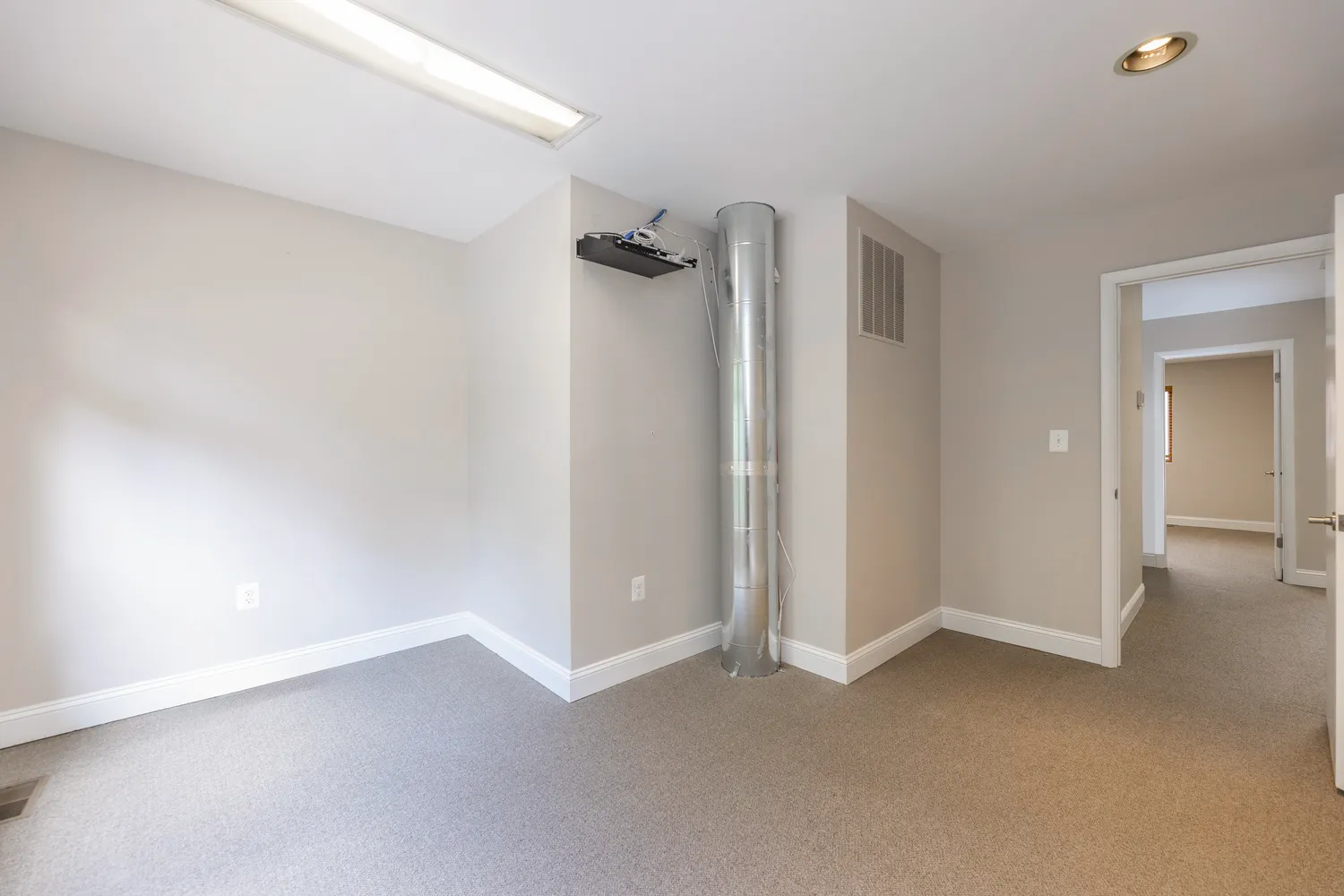 a view of a room with drop ceiling