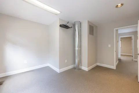 a view of a room with drop ceiling