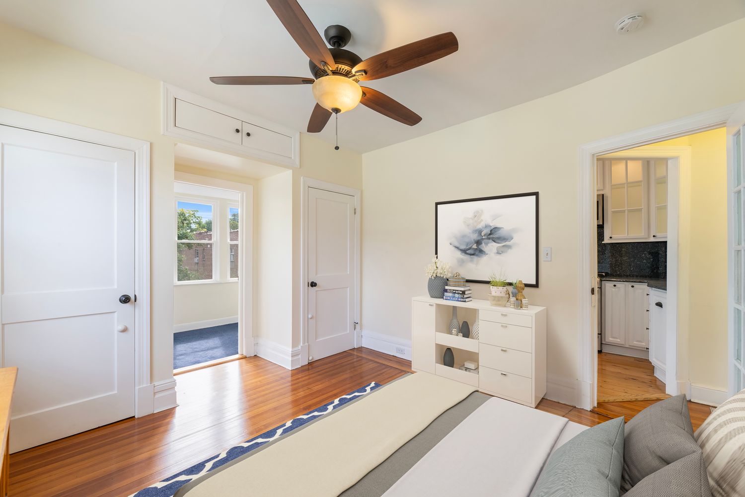 a bedroom with a bed and a view of bedroom