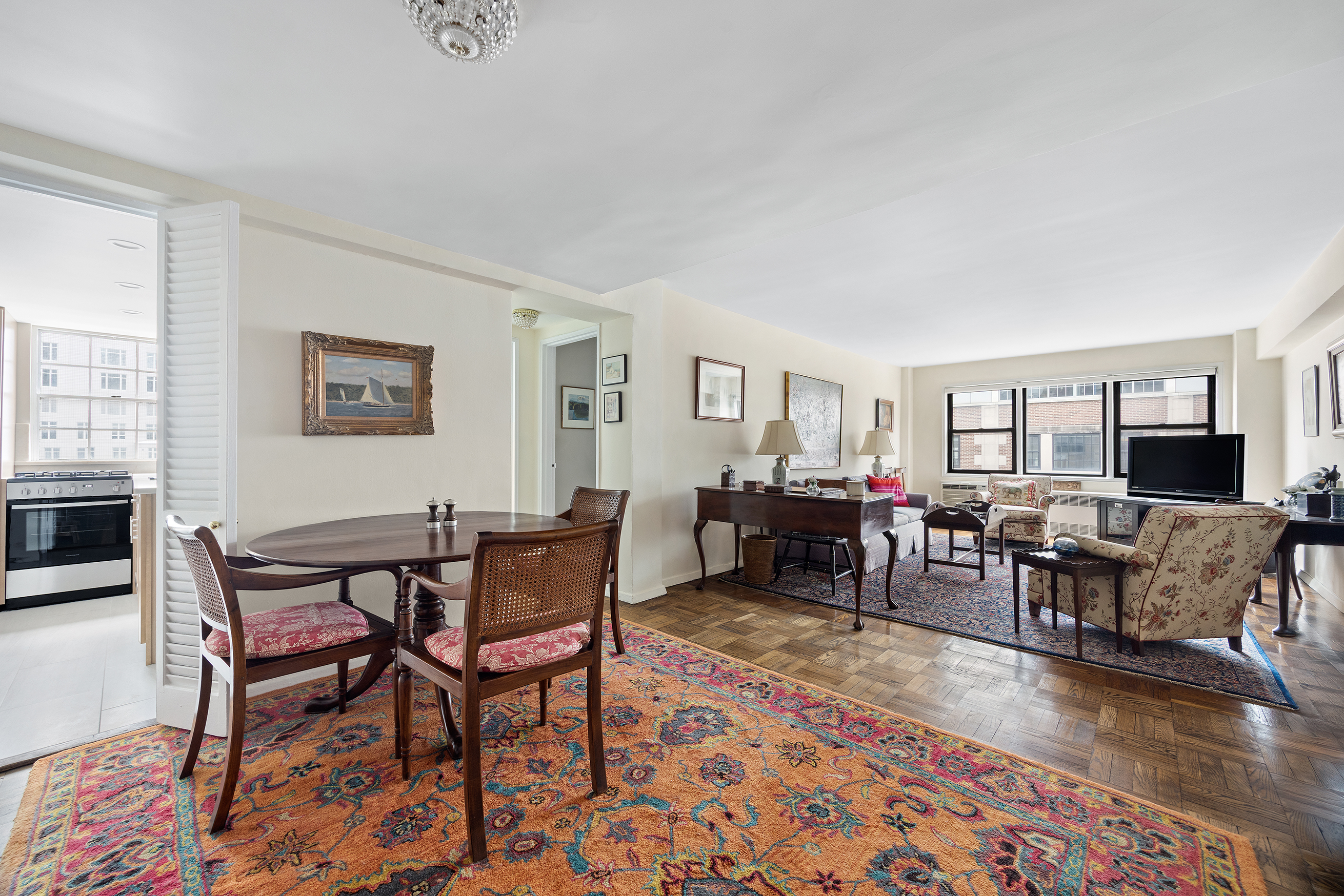 205 East 77th Street, Unit 11B Manhattan, NY 10075 - Photo 3 of 11 a view of a livingroom with furniture and a rug
