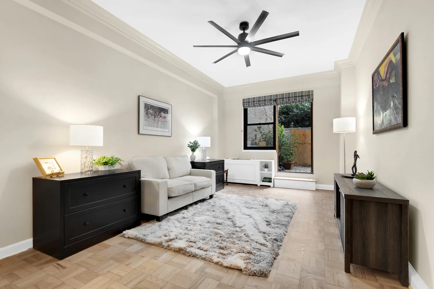 a living room with furniture and wooden floor