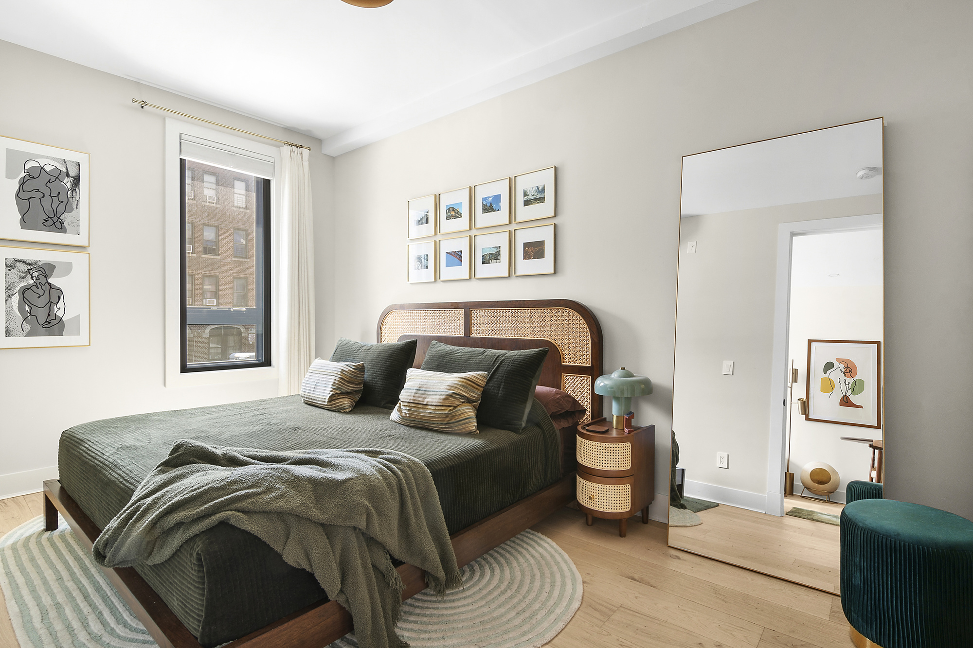 1489 Sterling Place, Unit 2A Brooklyn, NY 11213 - Photo 5 of 9 a bedroom with a bed and painting on the wall