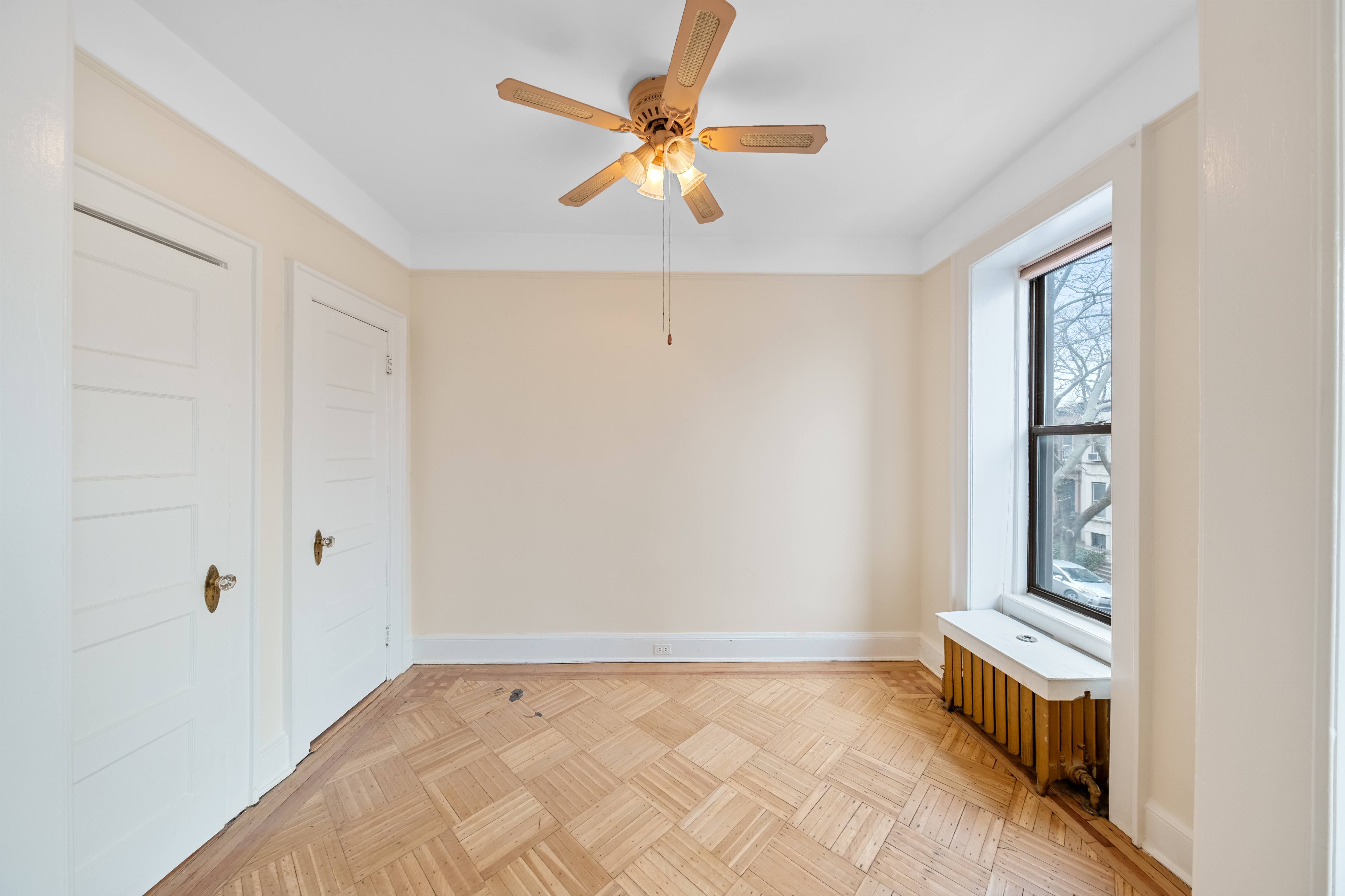 196 Maple Street Brooklyn, NY 11225 - Photo 12 of 31 a view of an empty room with a window