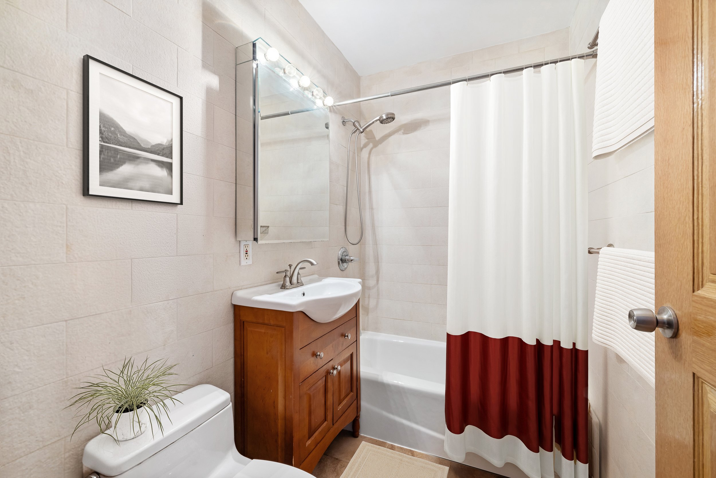 26 Monitor Street, Unit 1 Brooklyn, NY 11222 - Photo 7 of 11 a bathroom with a sink toilet and shower