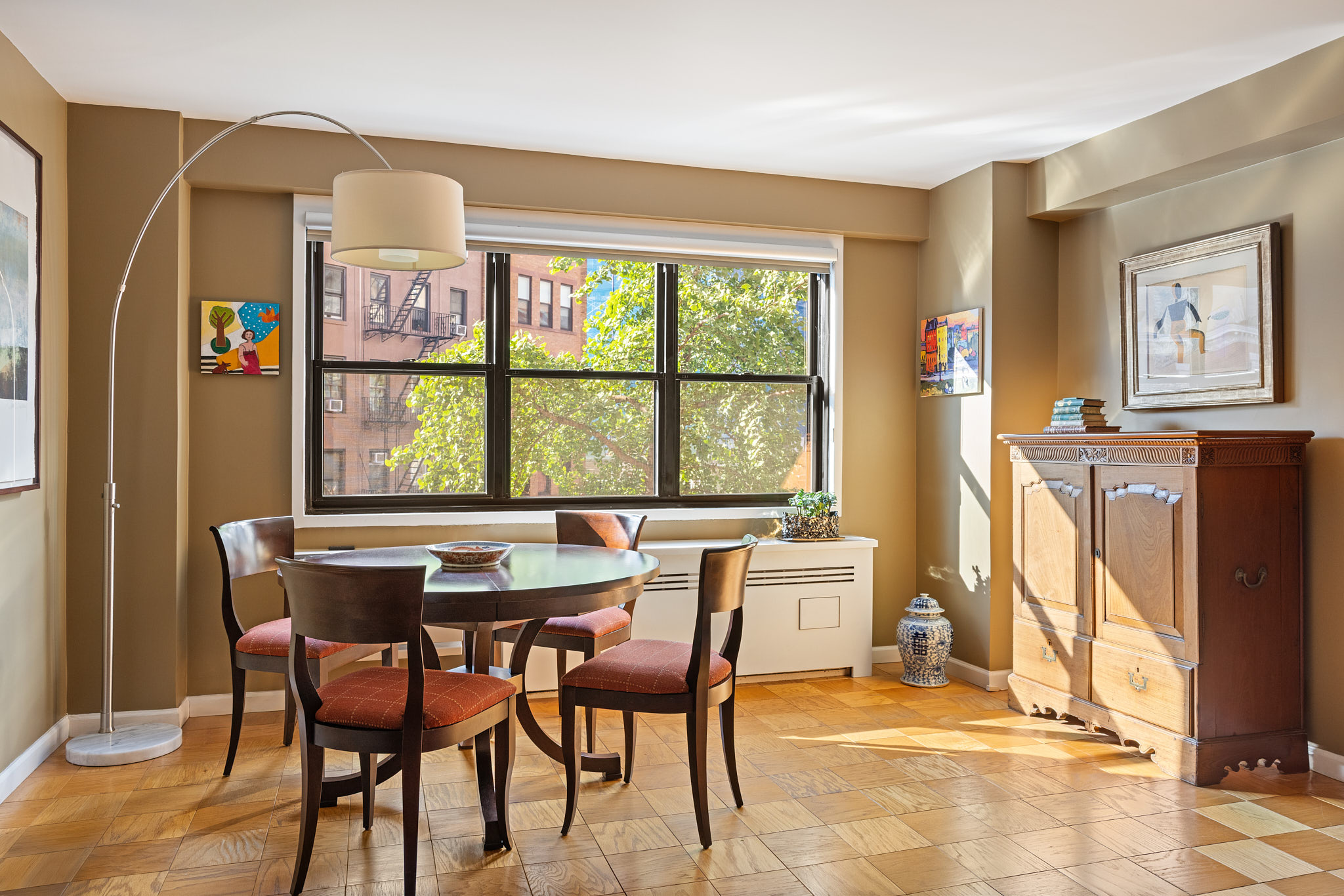 31 Jane Street, Unit 3H Manhattan, NY 10014 - Photo 2 of 14 a dining room with furniture and window