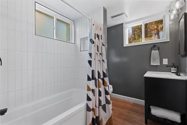 a bathroom with a bathtub and a shower