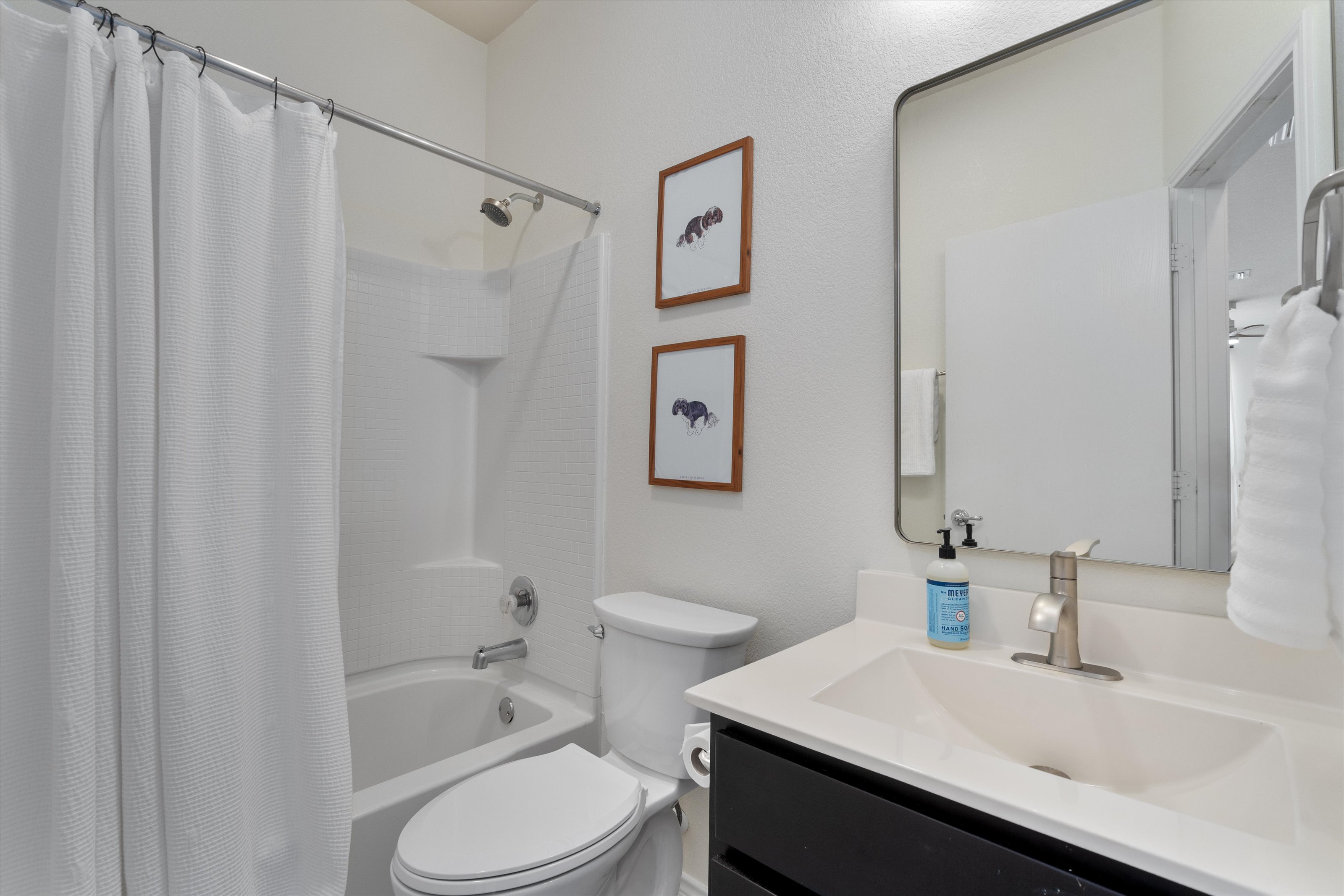 4330 Olenick Street Austin, TX 78723 - Photo 23 of 29 a bathroom with a sink toilet and shower