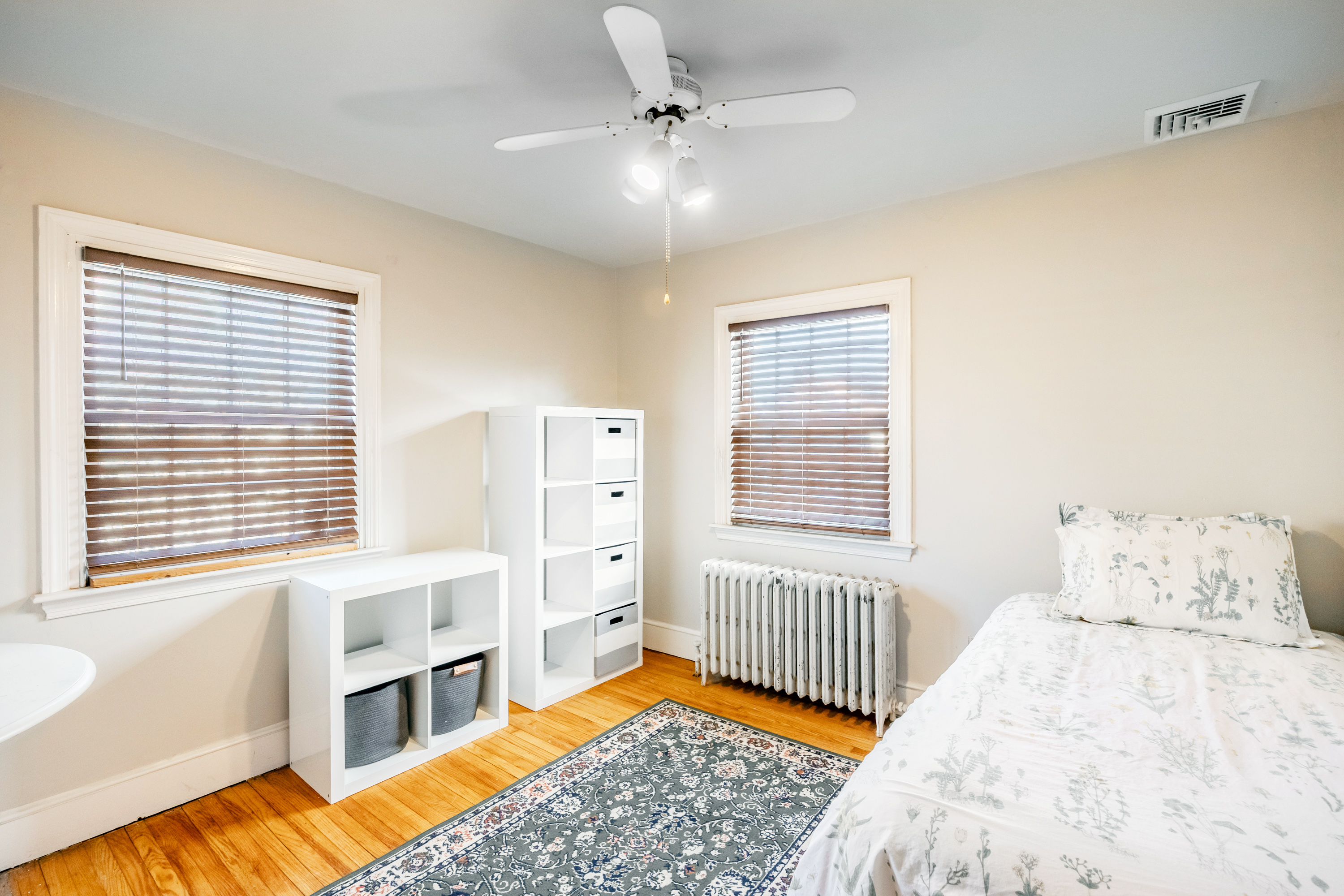 14 Decatur Road Havertown, PA 19083 - Photo 28 of 43 a bedroom with a bed next to a window with a chandelier