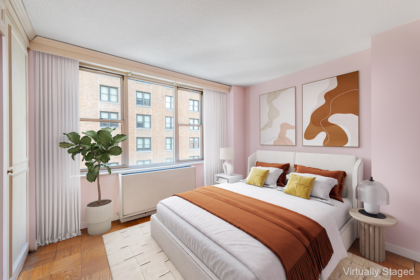 137 East 36th Street, Unit 7H Manhattan, NY 10016 - Photo 2 of 11 a bedroom with a bed and a potted plant