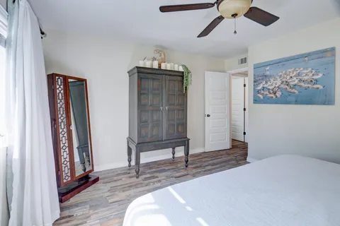 a bedroom with furniture and window