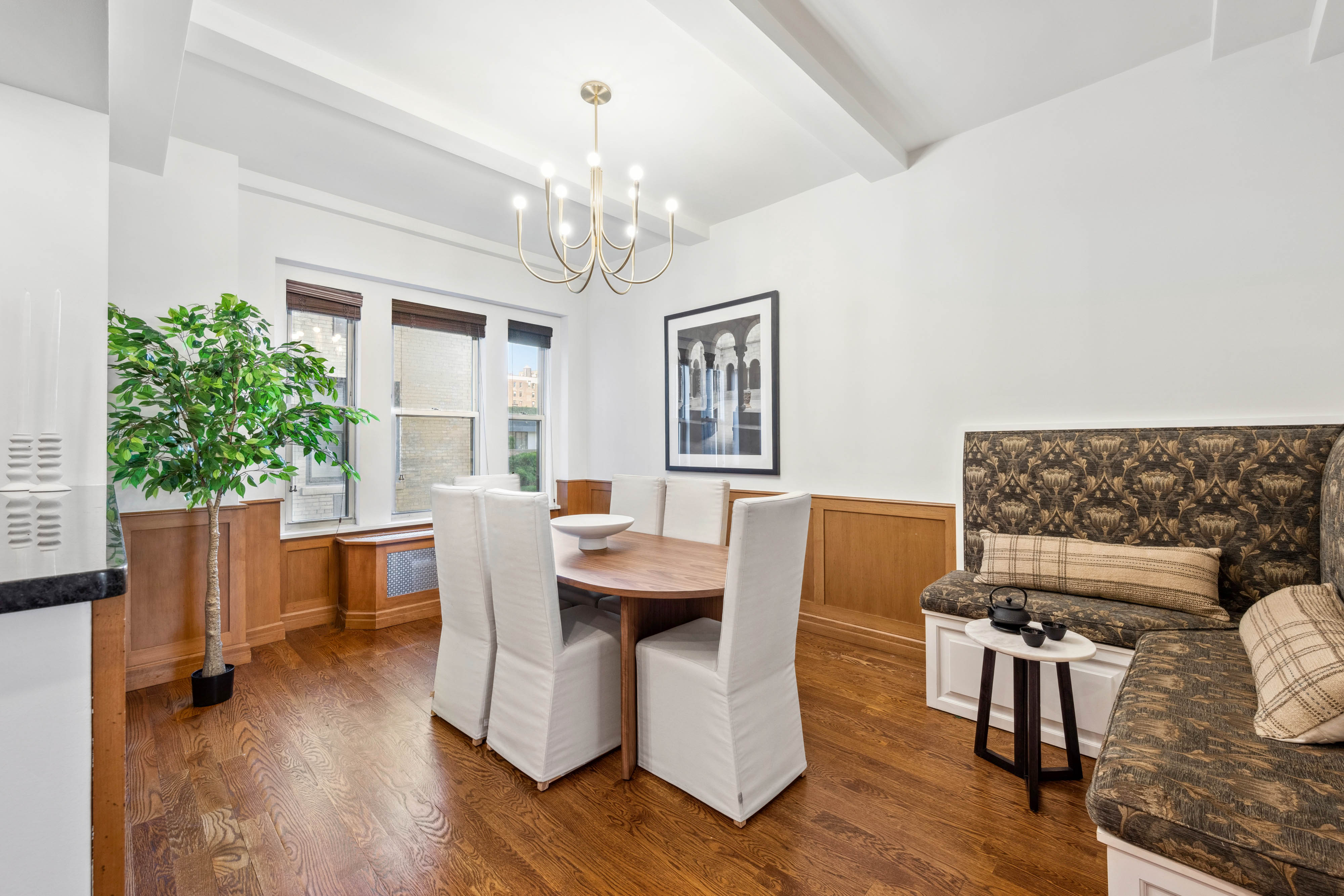 25 5th Avenue, Unit 6C Manhattan, NY 10003 - Photo 5 of 16 a view of a dining room with furniture window and wooden floor
