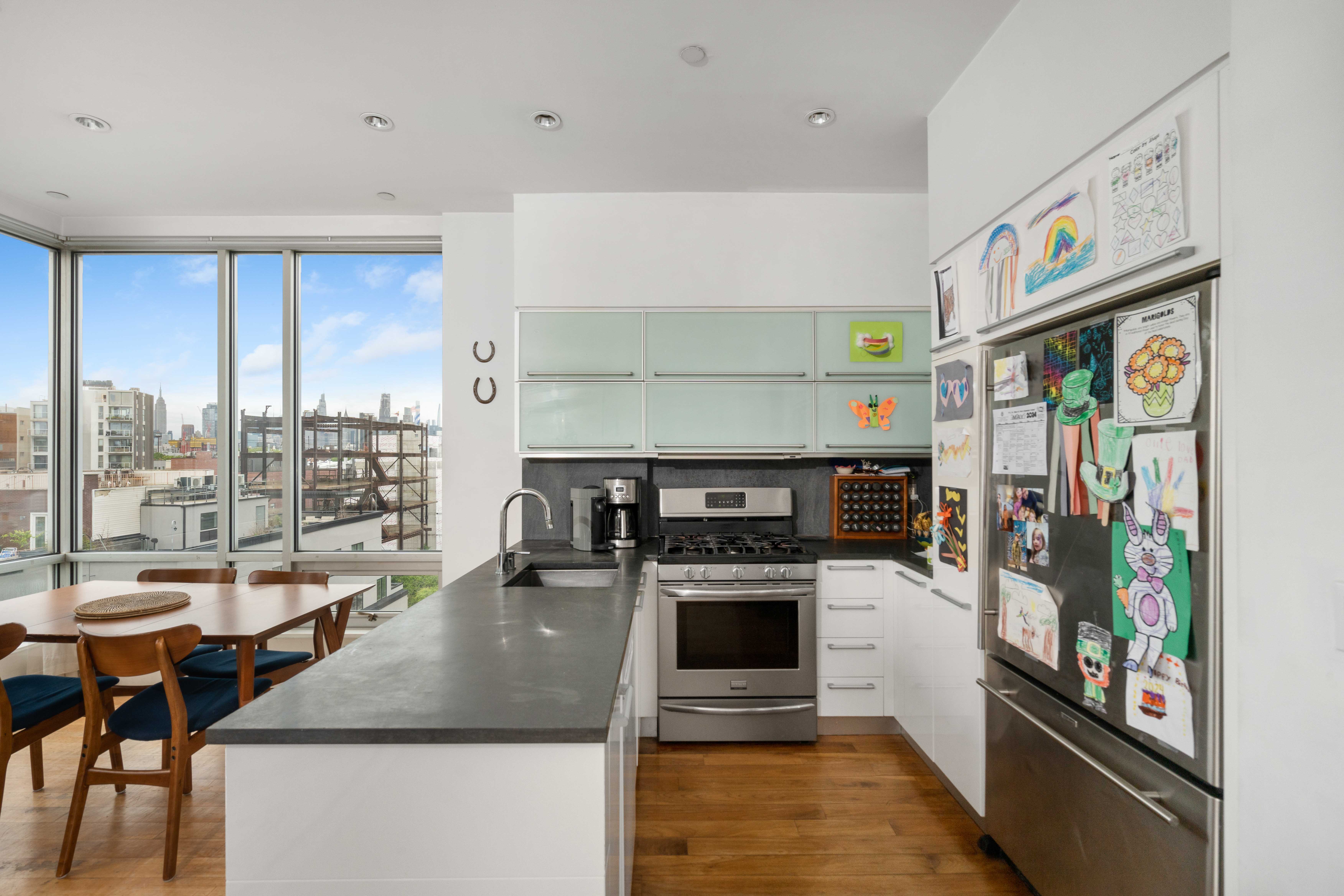 36 Eckford Street, Unit 6B Brooklyn, NY 11222 - Photo 2 of 8 a kitchen with a stove a refrigerator and a stove top oven