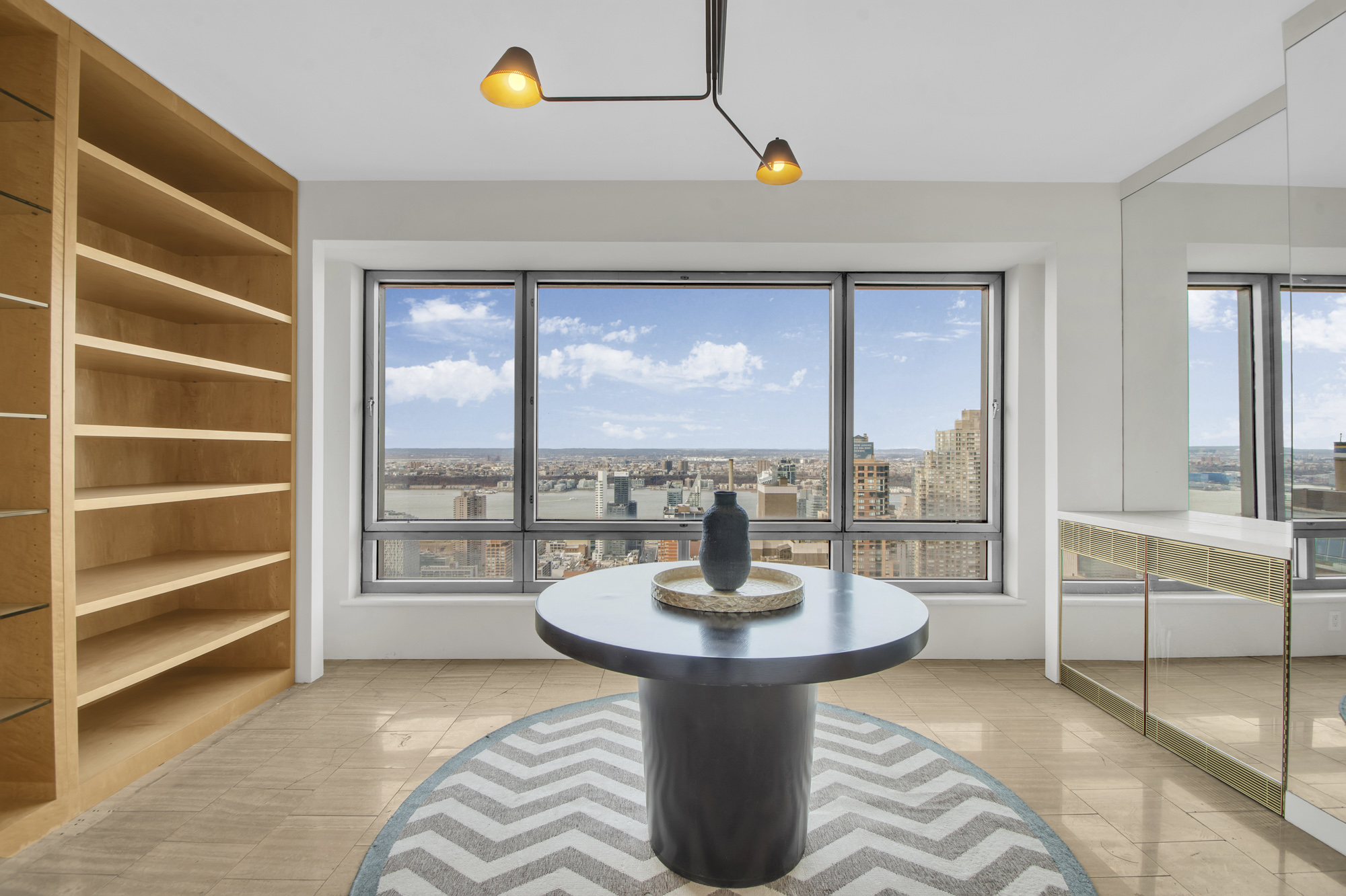 301 West 57th Street, Unit 48A Manhattan, NY 10019 - Photo 11 of 22 a view of a living room and a balcony
