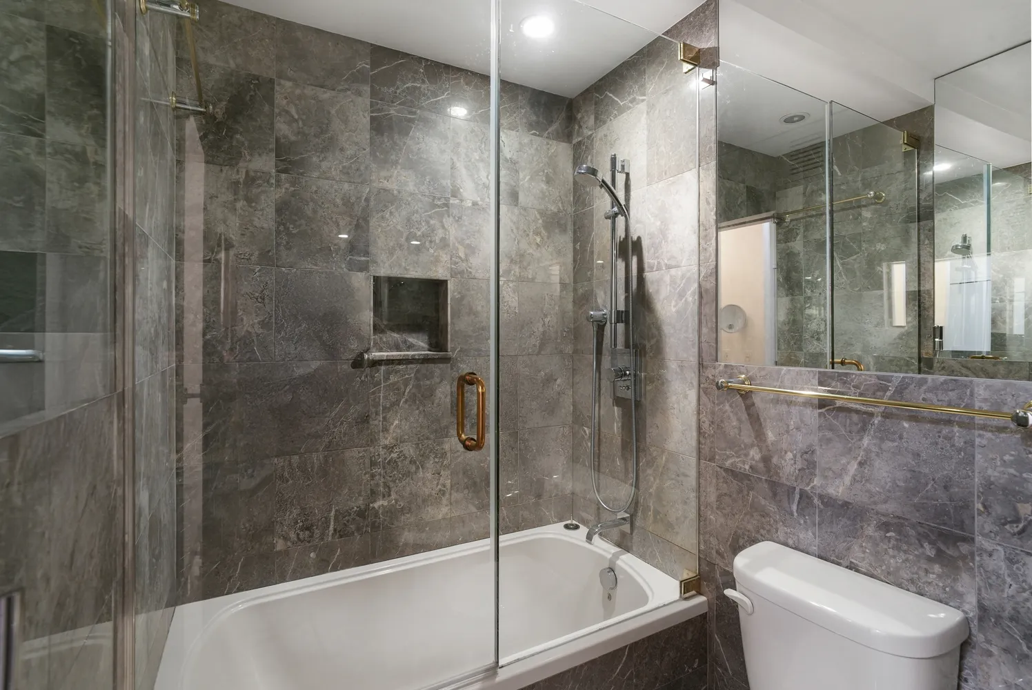 a bathroom with a shower and a toilet