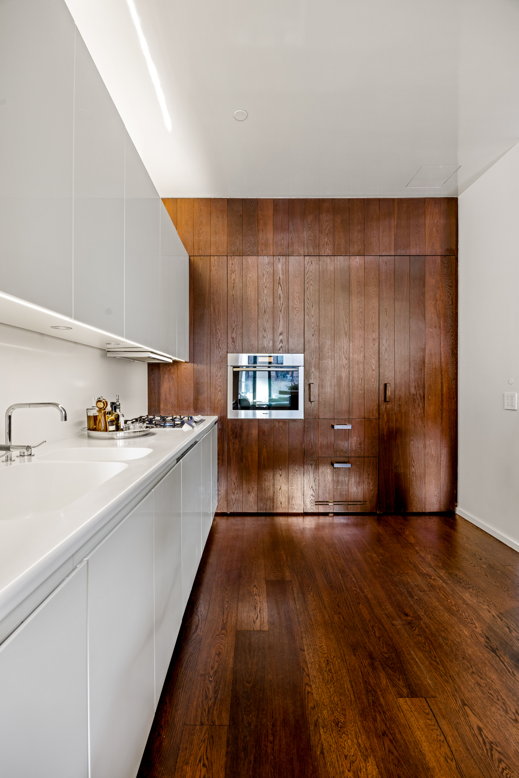 40 Bond Street, Unit 6D Manhattan, NY 10012 - Photo 11 of 23 a kitchen with counter top space and appliances