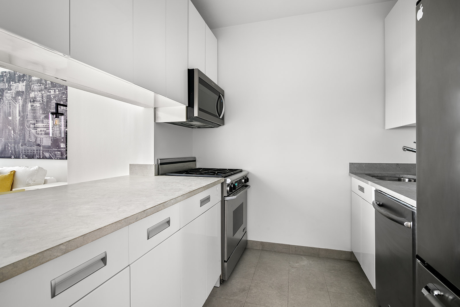 99 John Street, Unit 522 Manhattan, NY 10038 - Photo 5 of 11 a kitchen with a sink and a stove top oven