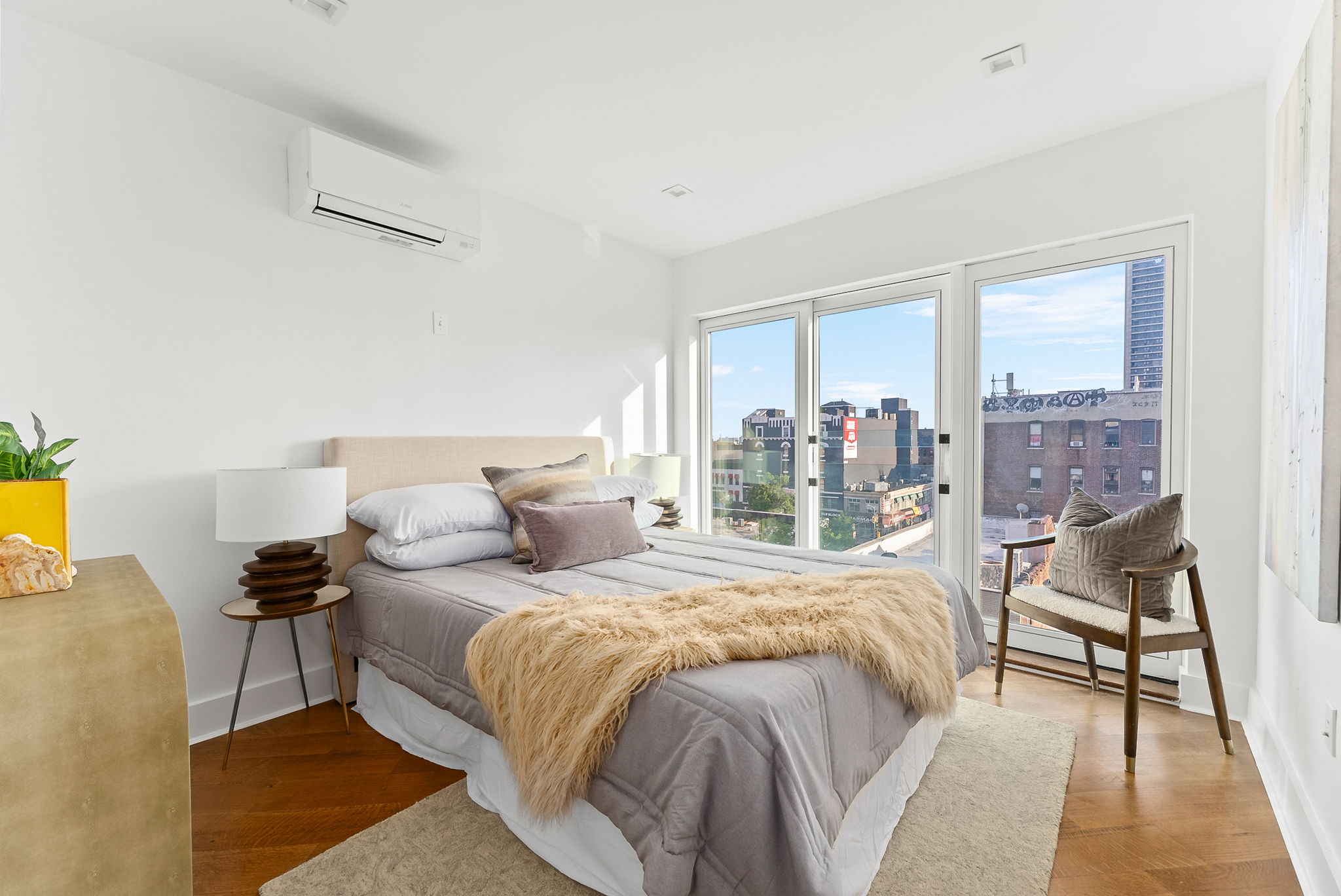 553 West 182nd Street, Unit 5R Manhattan, NY 10033 - Photo 10 of 12 a bedroom with a bed and a table