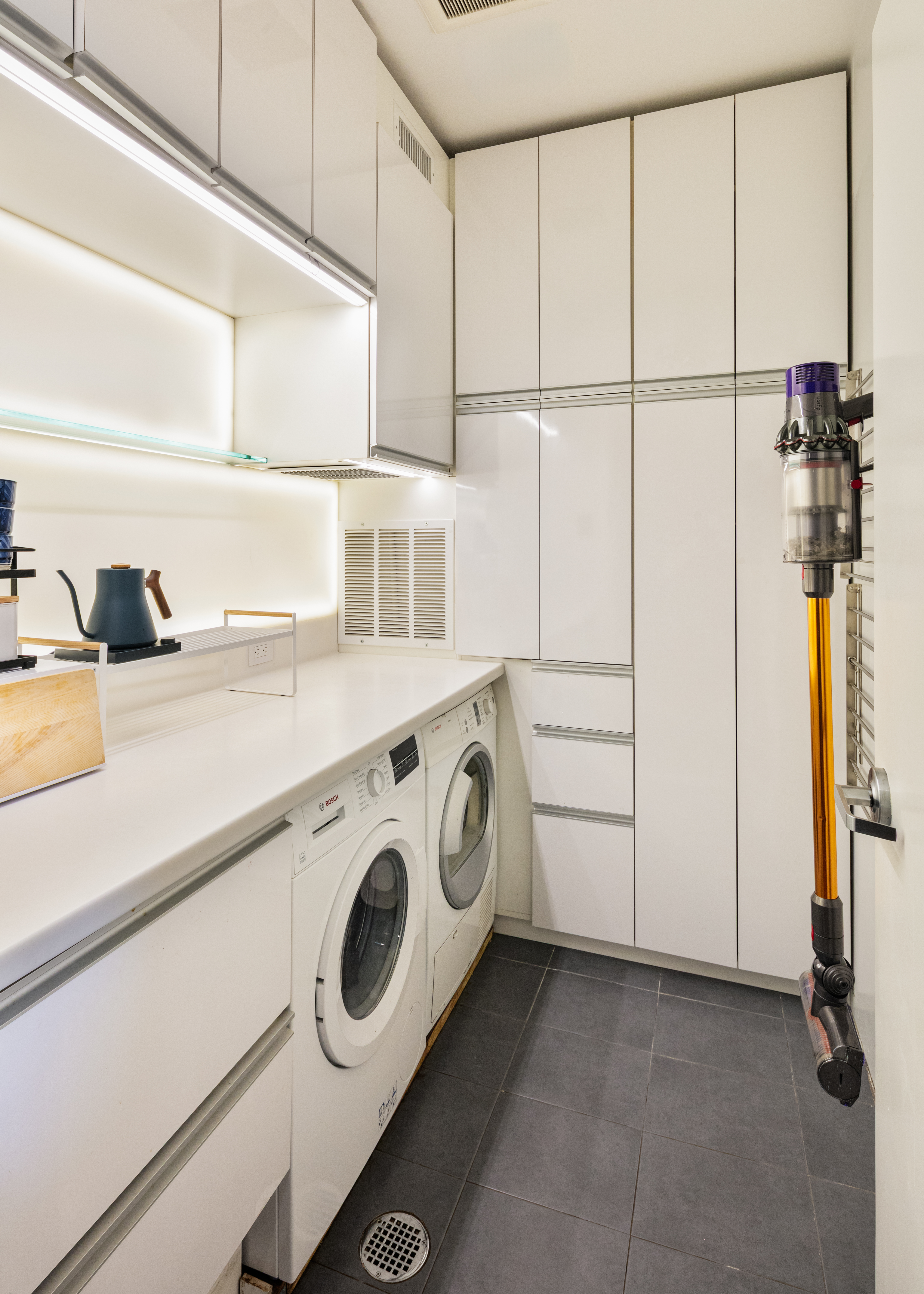 111 Monroe Street, Unit 4B Brooklyn, NY 11216 - Photo 7 of 8 a utility room with dryer and washer