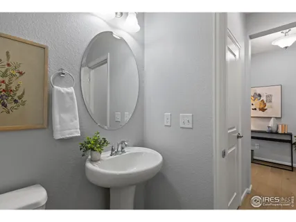 a bedroom with bed and a chandelier