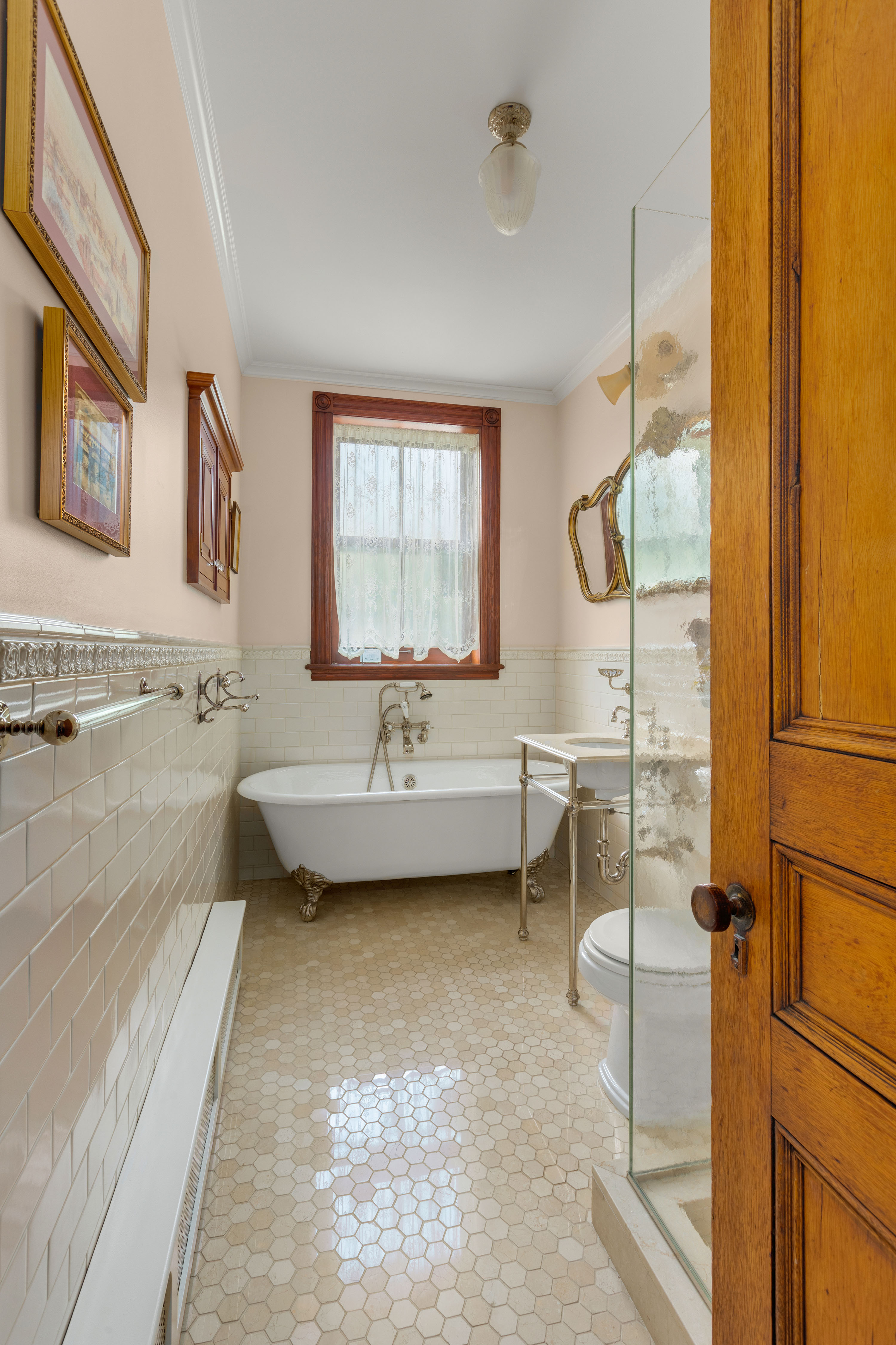 470 9th Street Brooklyn, NY 11215 - Photo 14 of 25 a bathroom with a tub sink toilet and mirror