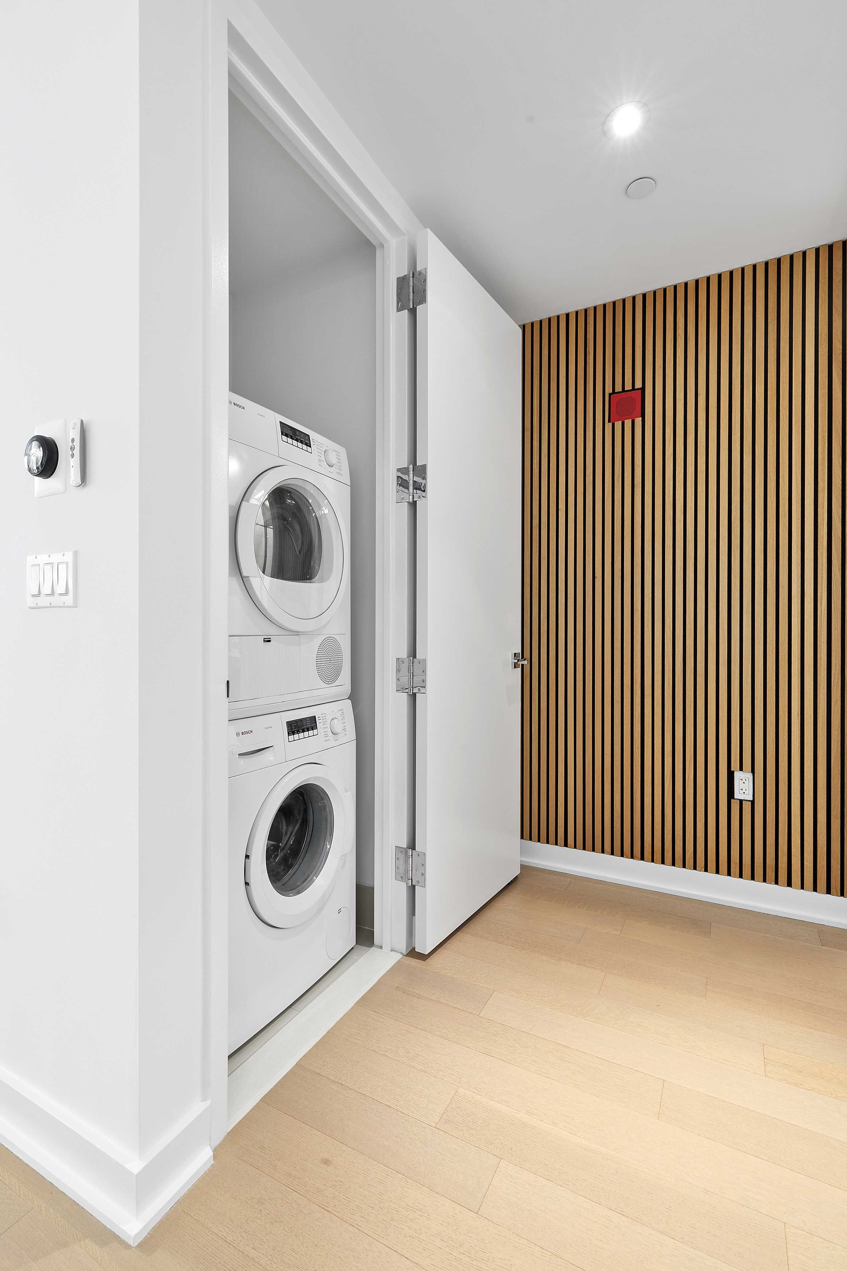 400 Park Avenue South, Unit 23G Manhattan, NY 10016 - Photo 3 of 7 a view of a hallway with washer and dryer