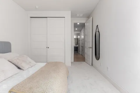 a living room with furniture a air conditioner vent and a window