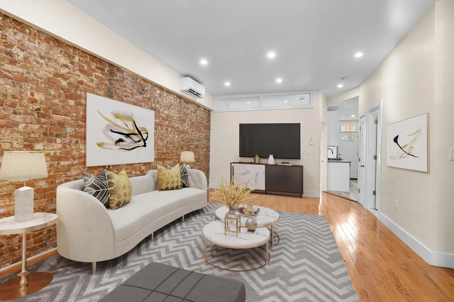 a living room with furniture and a flat screen tv