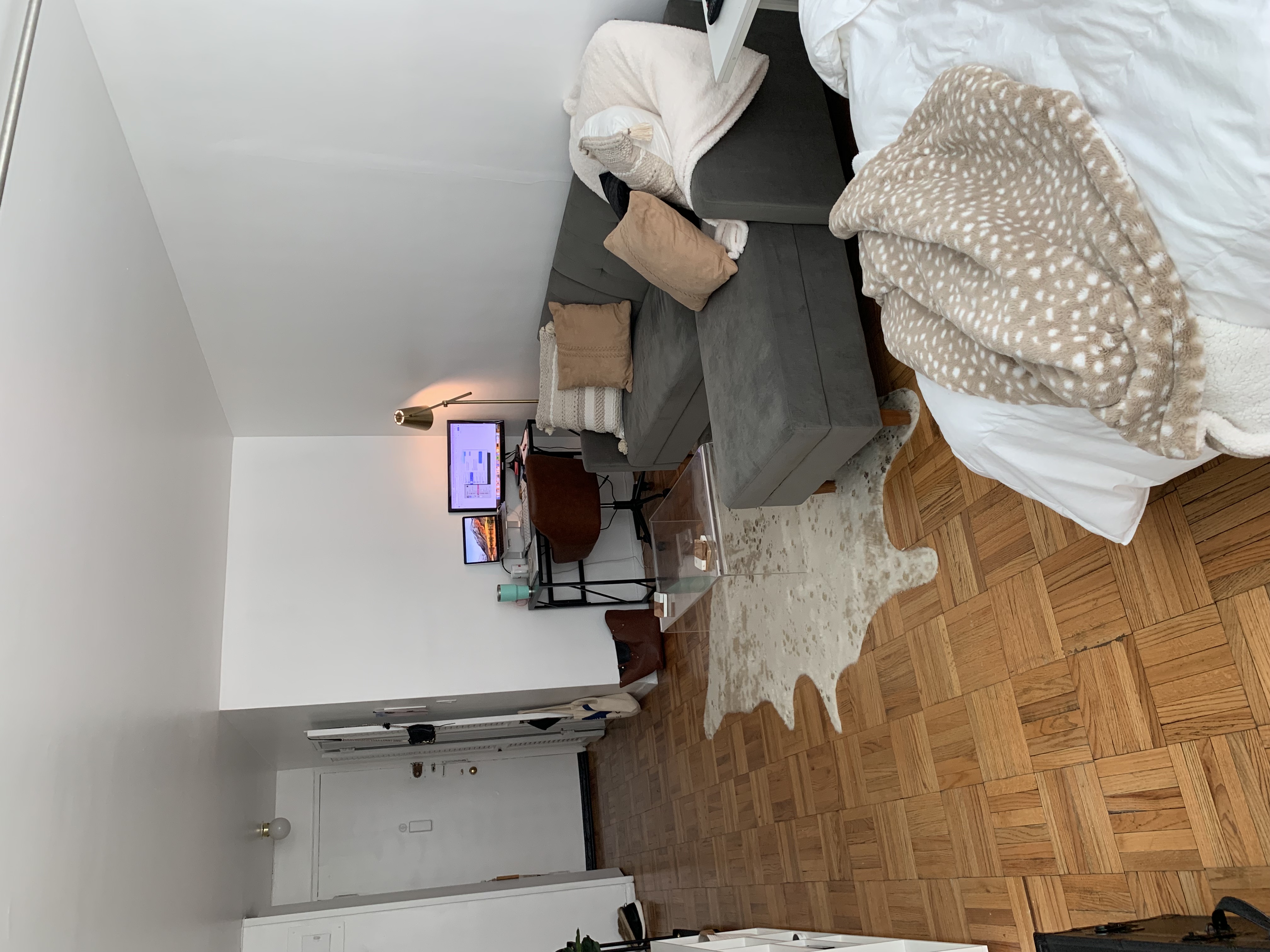 301 East 22nd Street, Unit 5G Manhattan, NY 10010 - Photo 2 of 10 a bedroom with a bed and a dresser