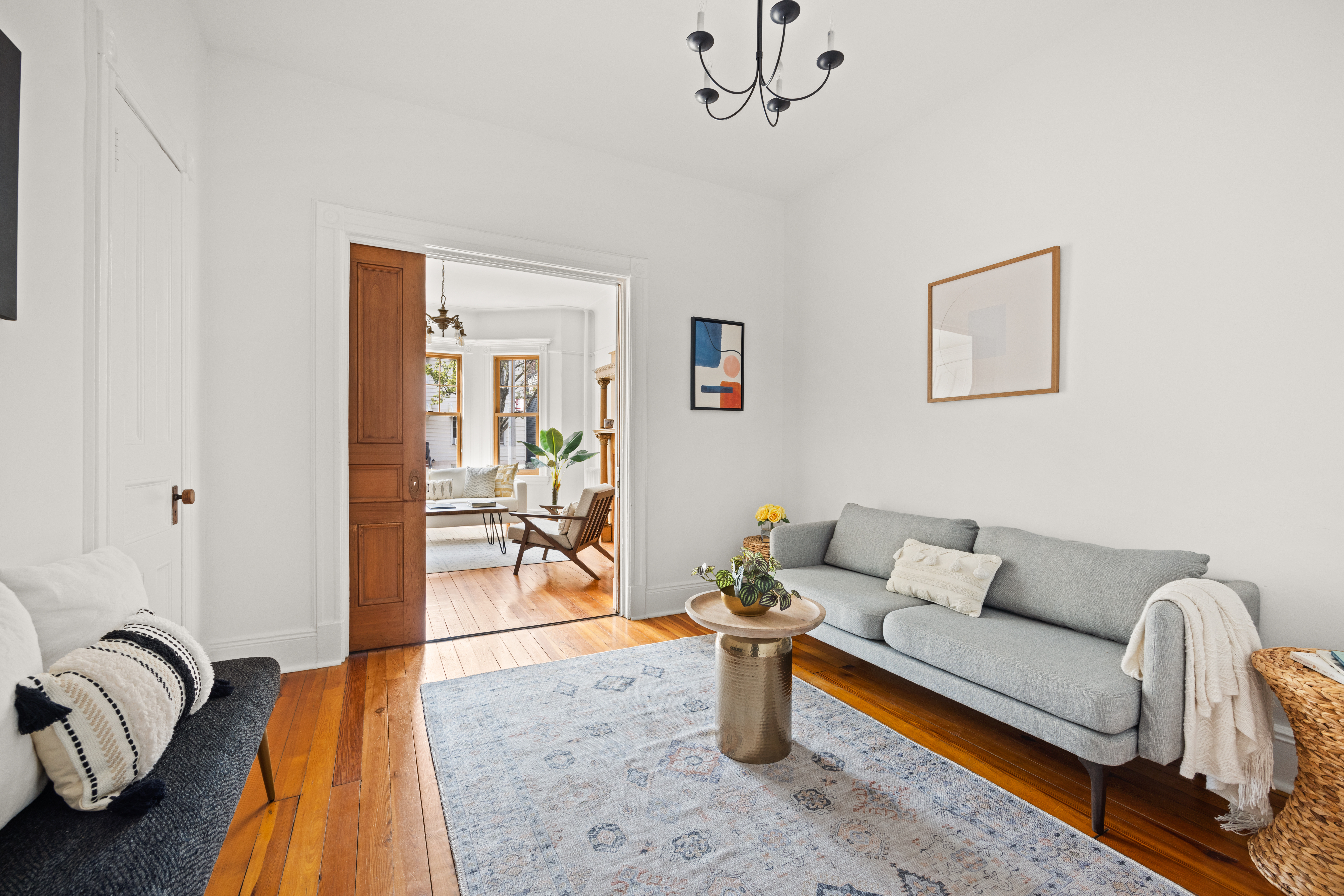 99 East 2nd Street Brooklyn, NY 11218 - Photo 3 of 24 a living room with furniture a rug and a window