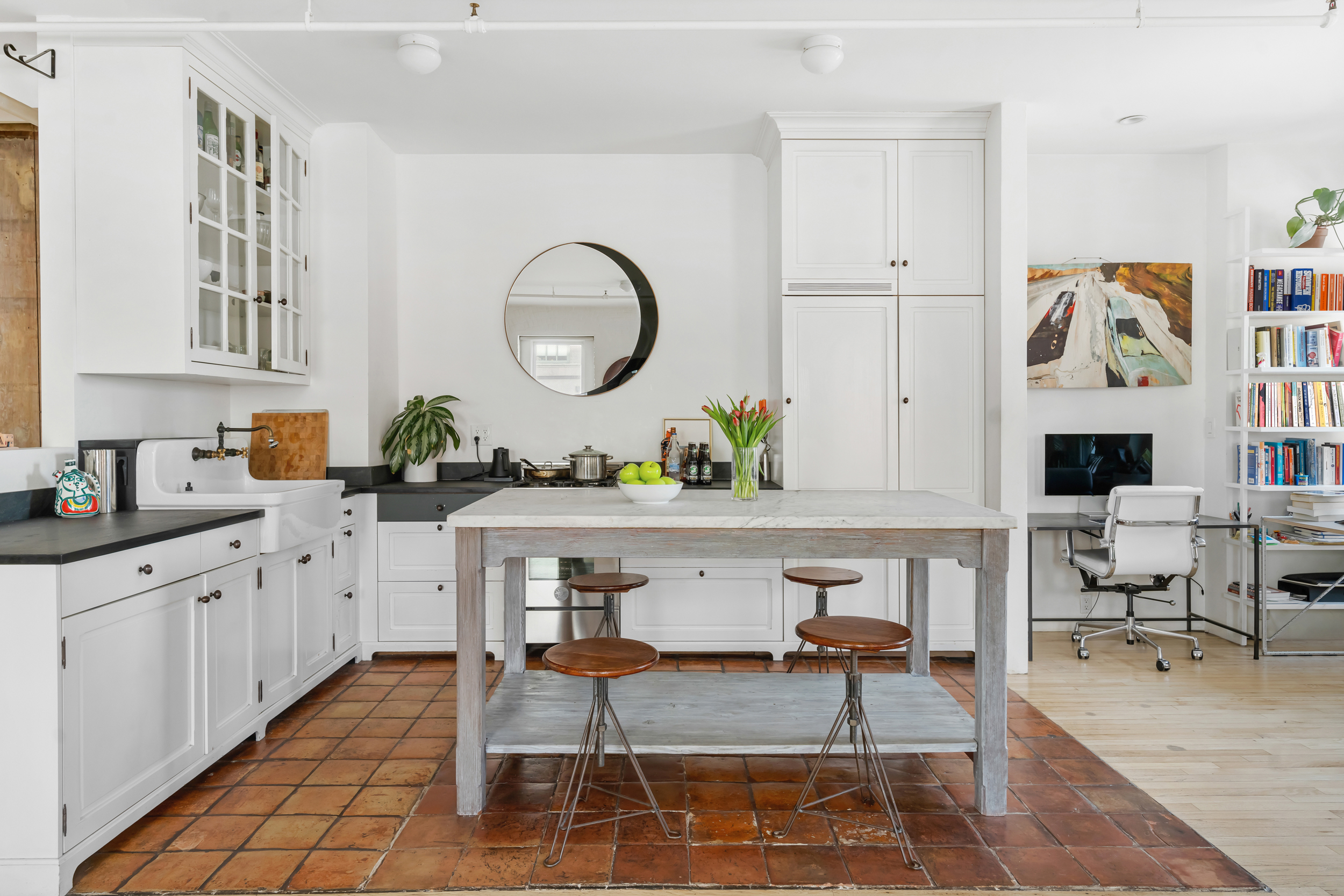 19 Hubert Street, Unit 3 Manhattan, NY 10013 - Photo 2 of 8 a living room with furniture and a large window