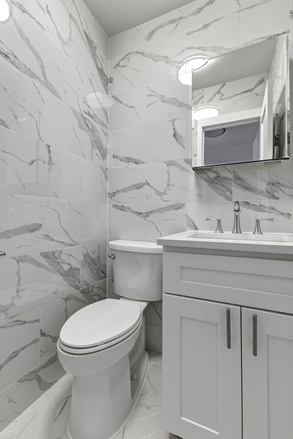 400 East 54th Street, Unit 24E Manhattan, NY 10022 - Photo 17 of 29 a bathroom with a toilet and a sink
